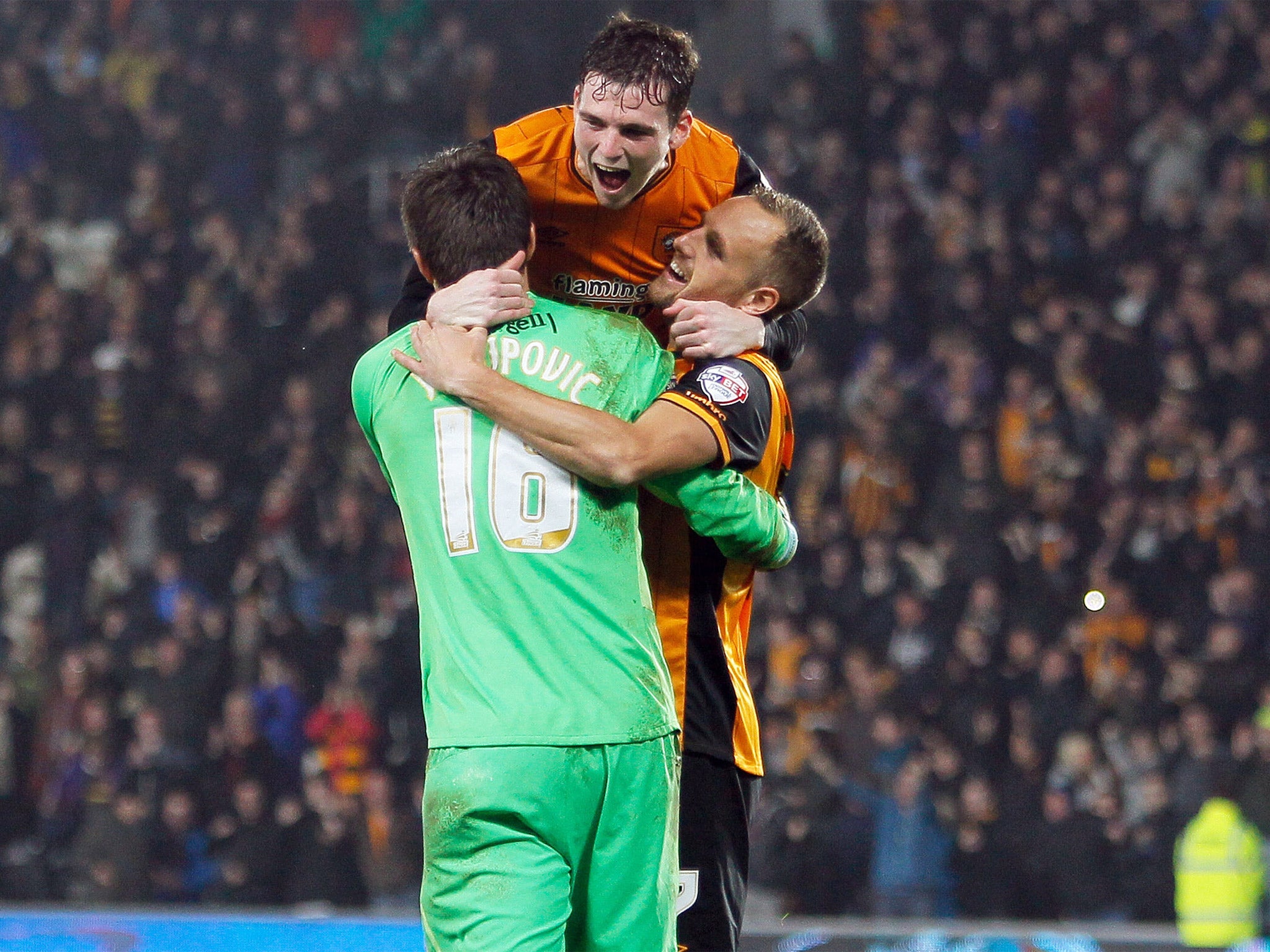 Hull City's David Meyler (right) and Andrew Robertson celebrate with goalkeeper Eldin Jakupovic