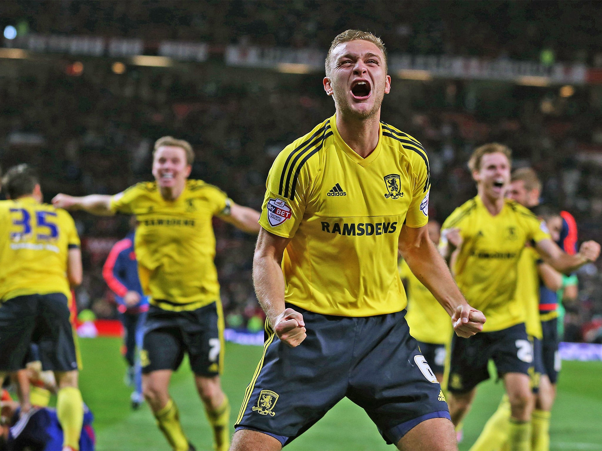 Ben Gibson, centre, and teammates celebrate their shoot-out victory