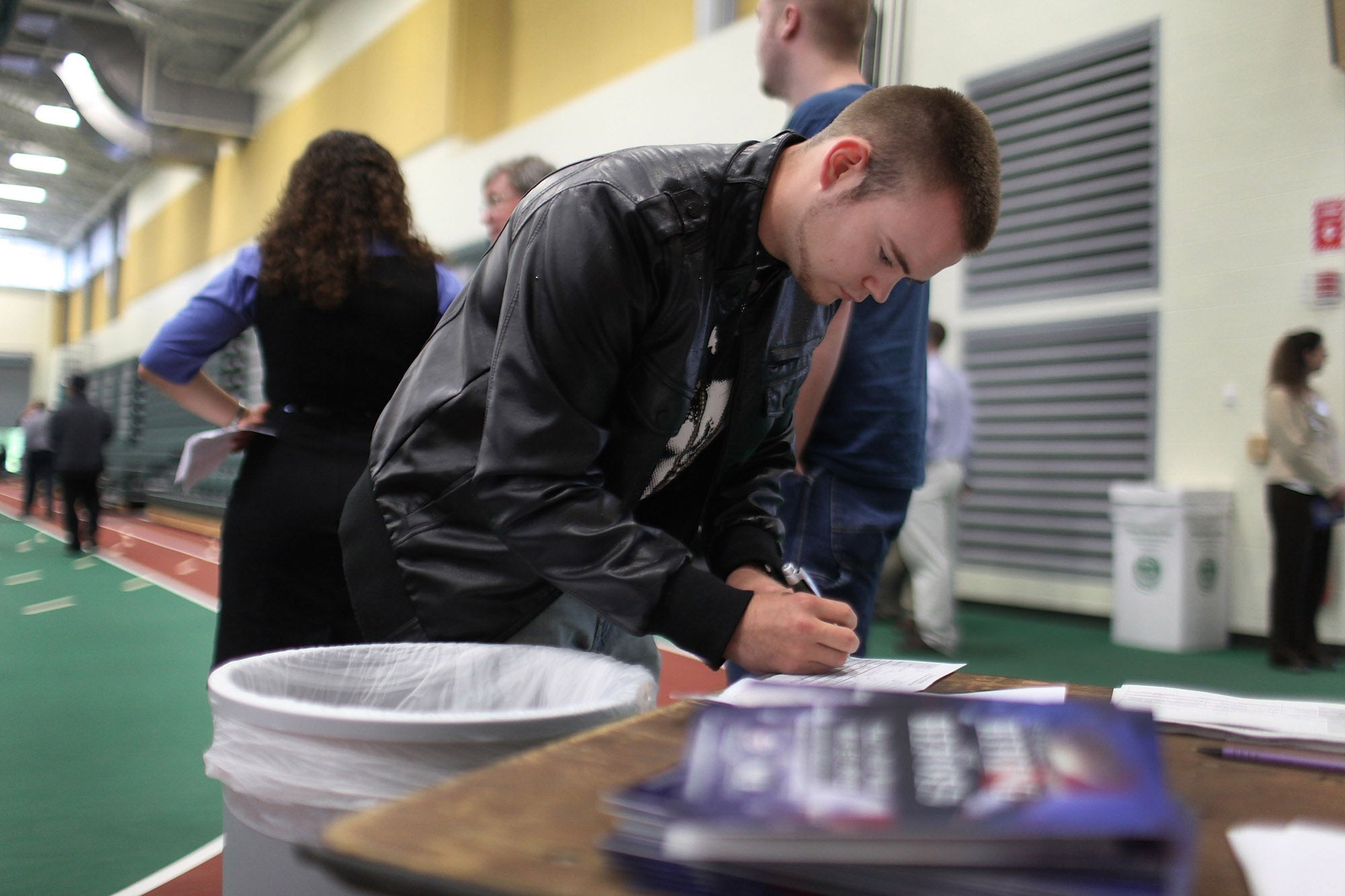 A chinstrap fills out a job application in New York.