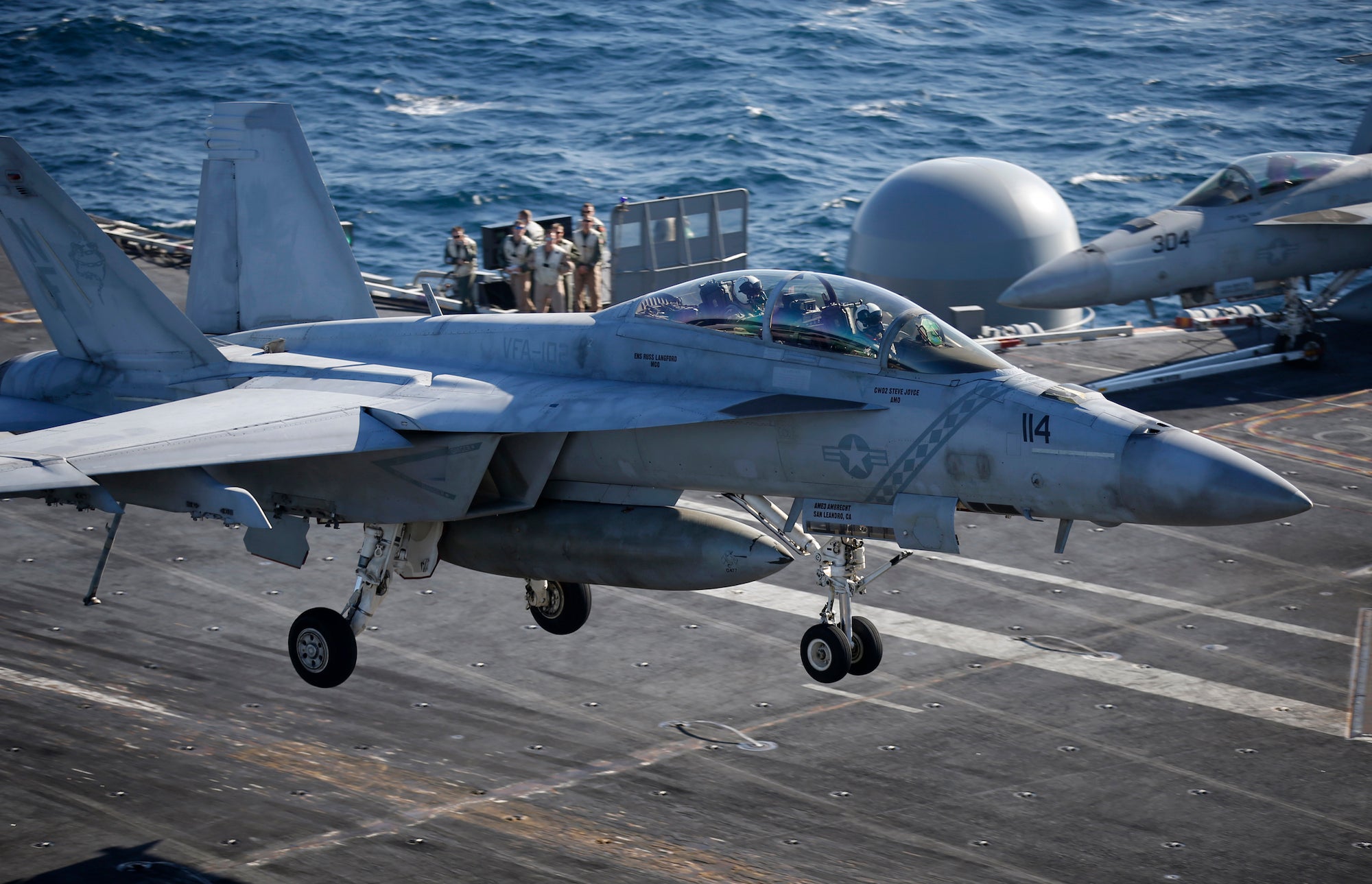 A US Navy F/A-18 Super Hornet lands on the USS Ronald Reagan.