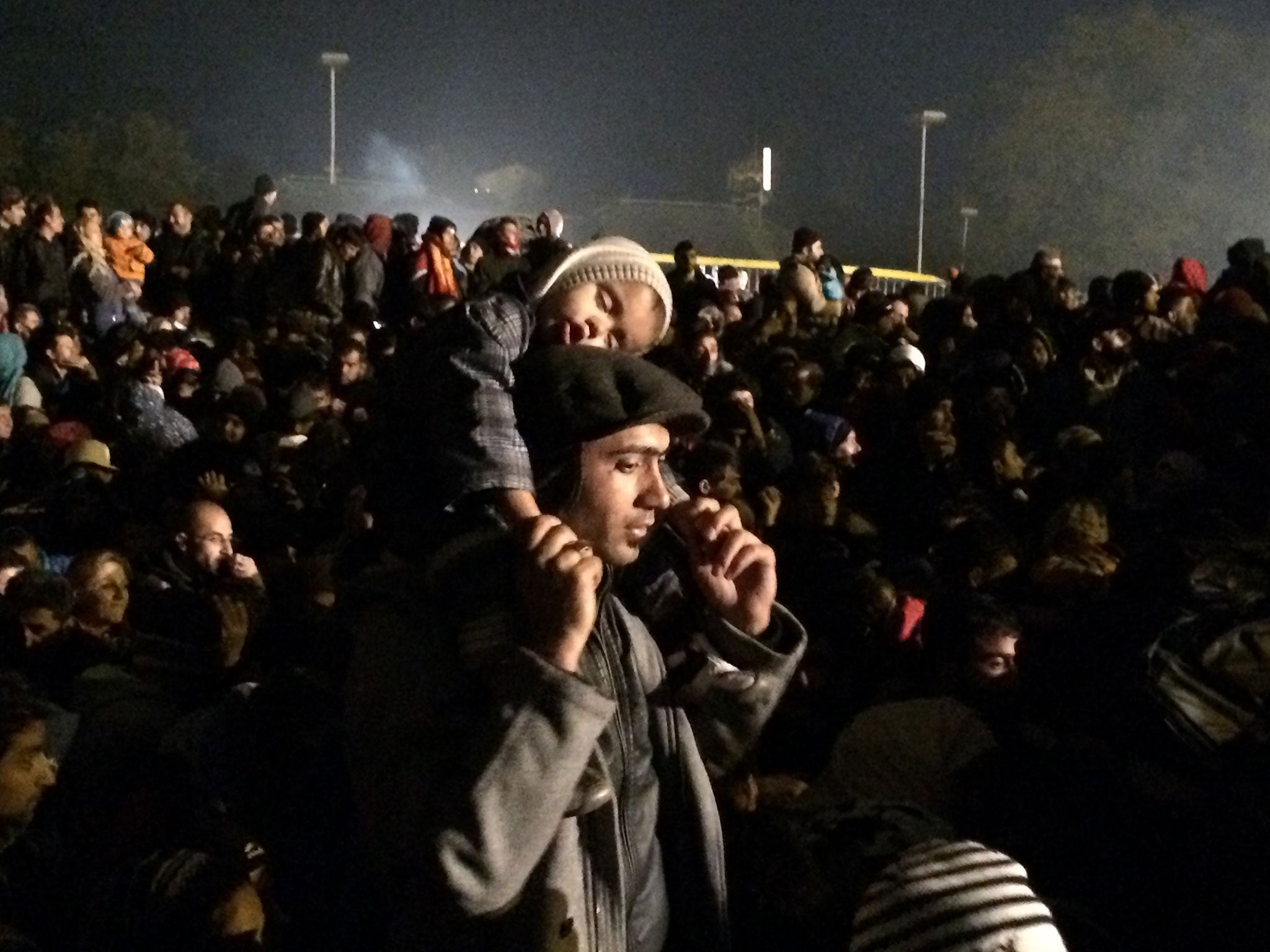 Refugees queuing at the border between Slovenia and Austria in Sentilj