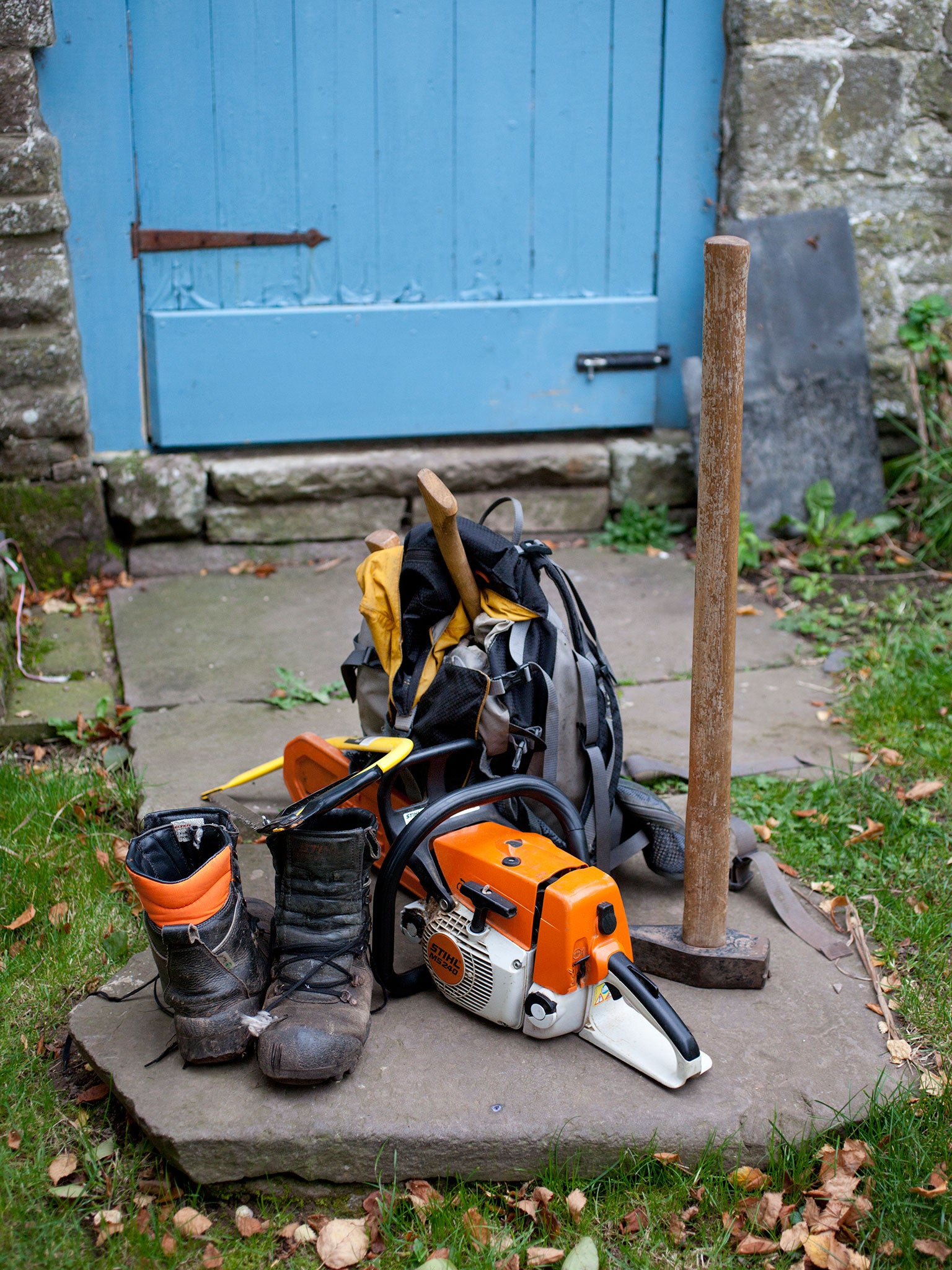 Tools of the trade: Rob uses a chainsaw and an axe