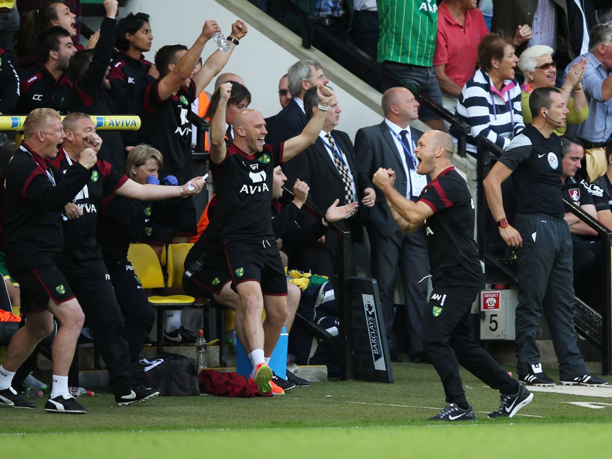 Alex Neil (right) celebrates Norwich’s third goal during the 3-1 win over Bournemouth at Carrow Road last month