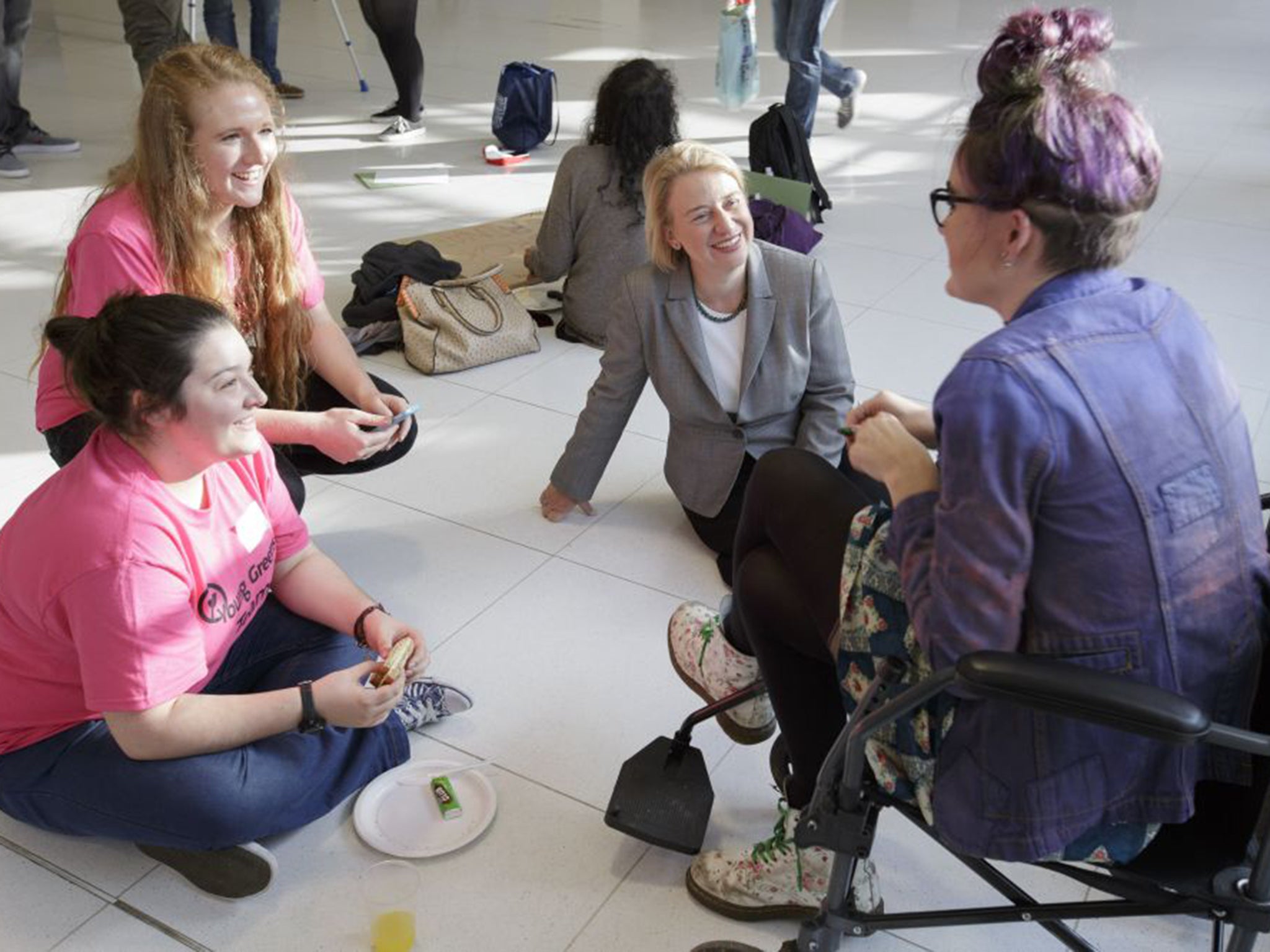 Natalie Bennett, centre, chats with delegates during lunch at the Young Greens conference