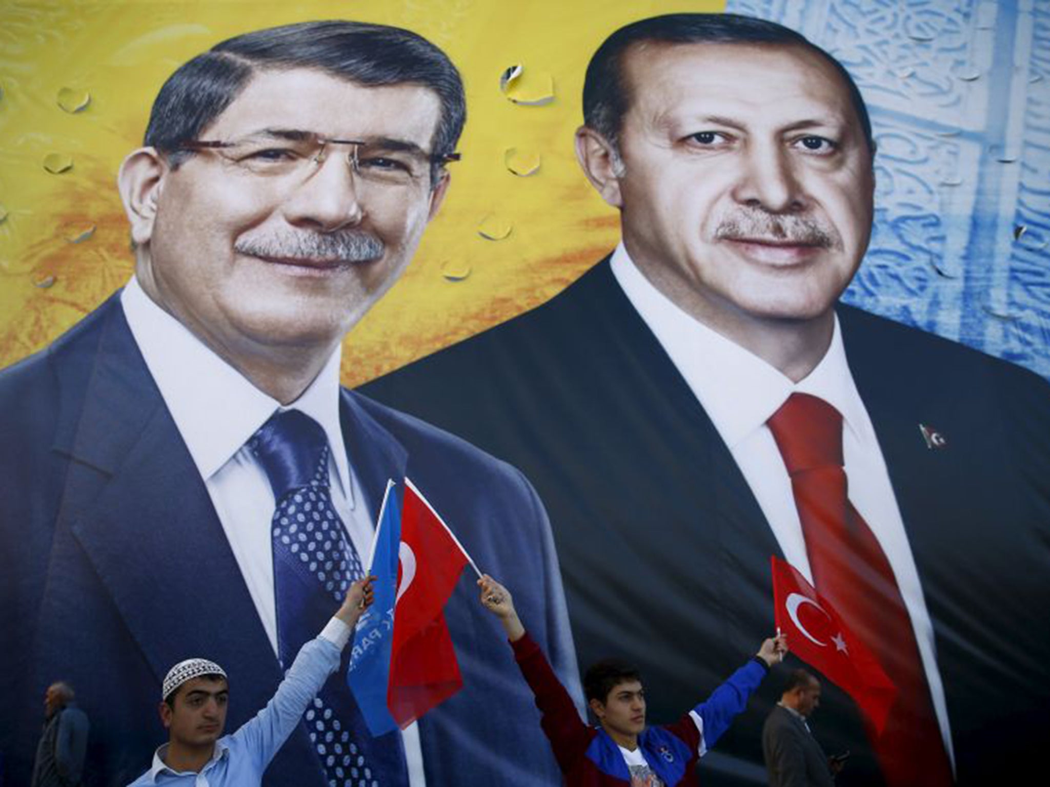 Recep Tayyip Erdogan, right, and Prime Minister Ahmet Davutoglu on a campaign banner