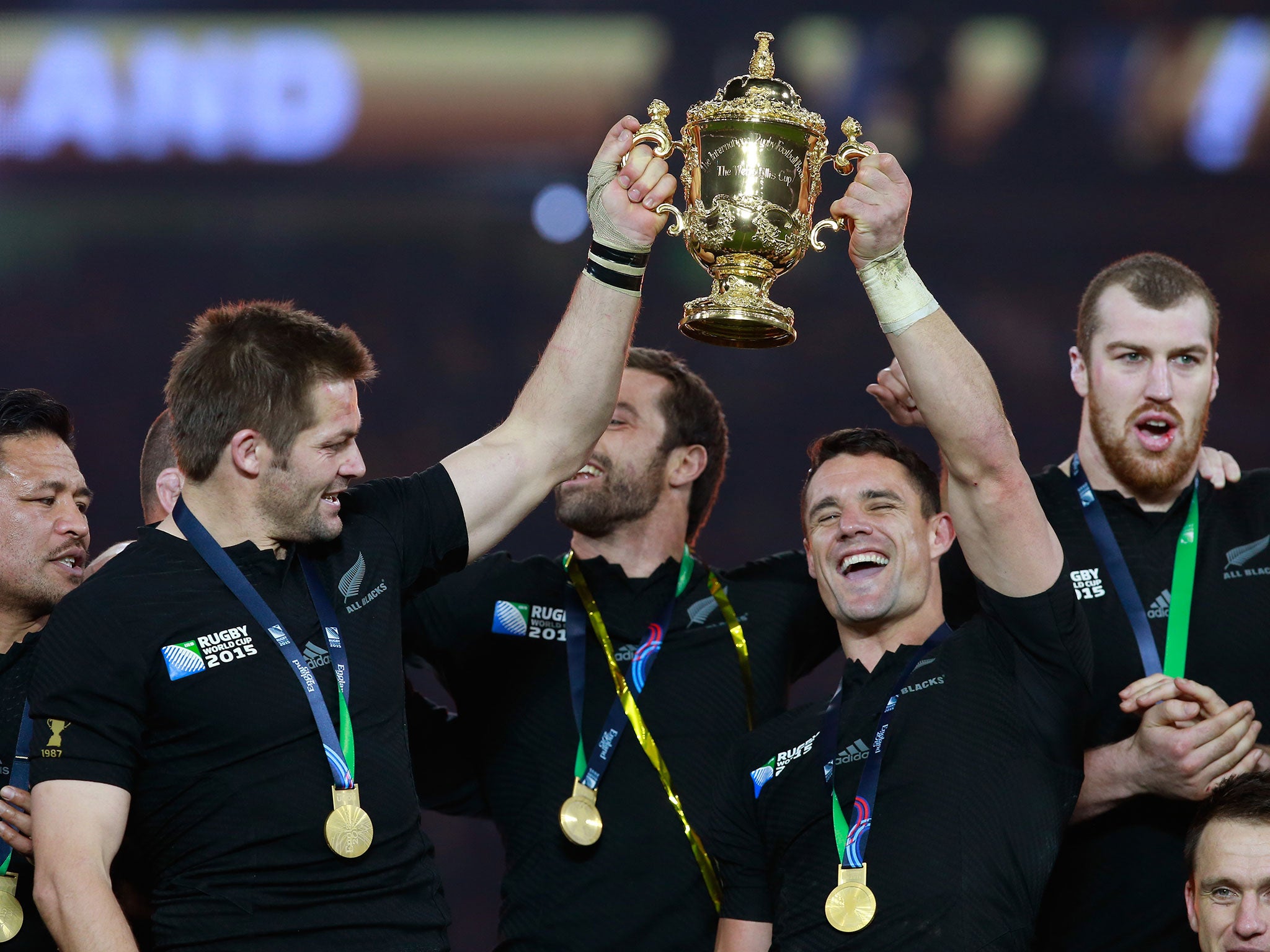 Richie McCaw and Dan Carter lift the Webb Ellis Cup