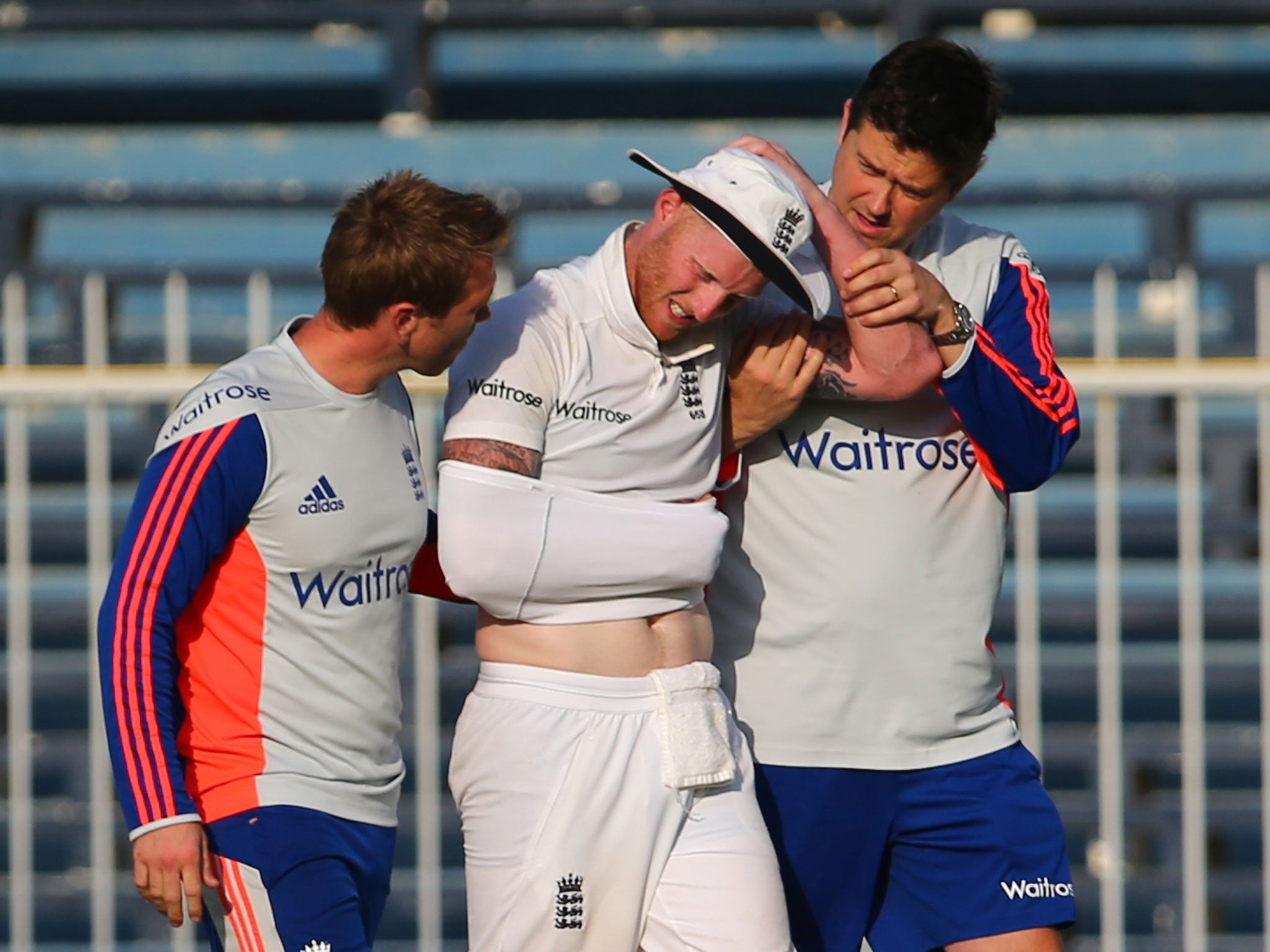 Ben Stokes goes off the field with a shoulder injury