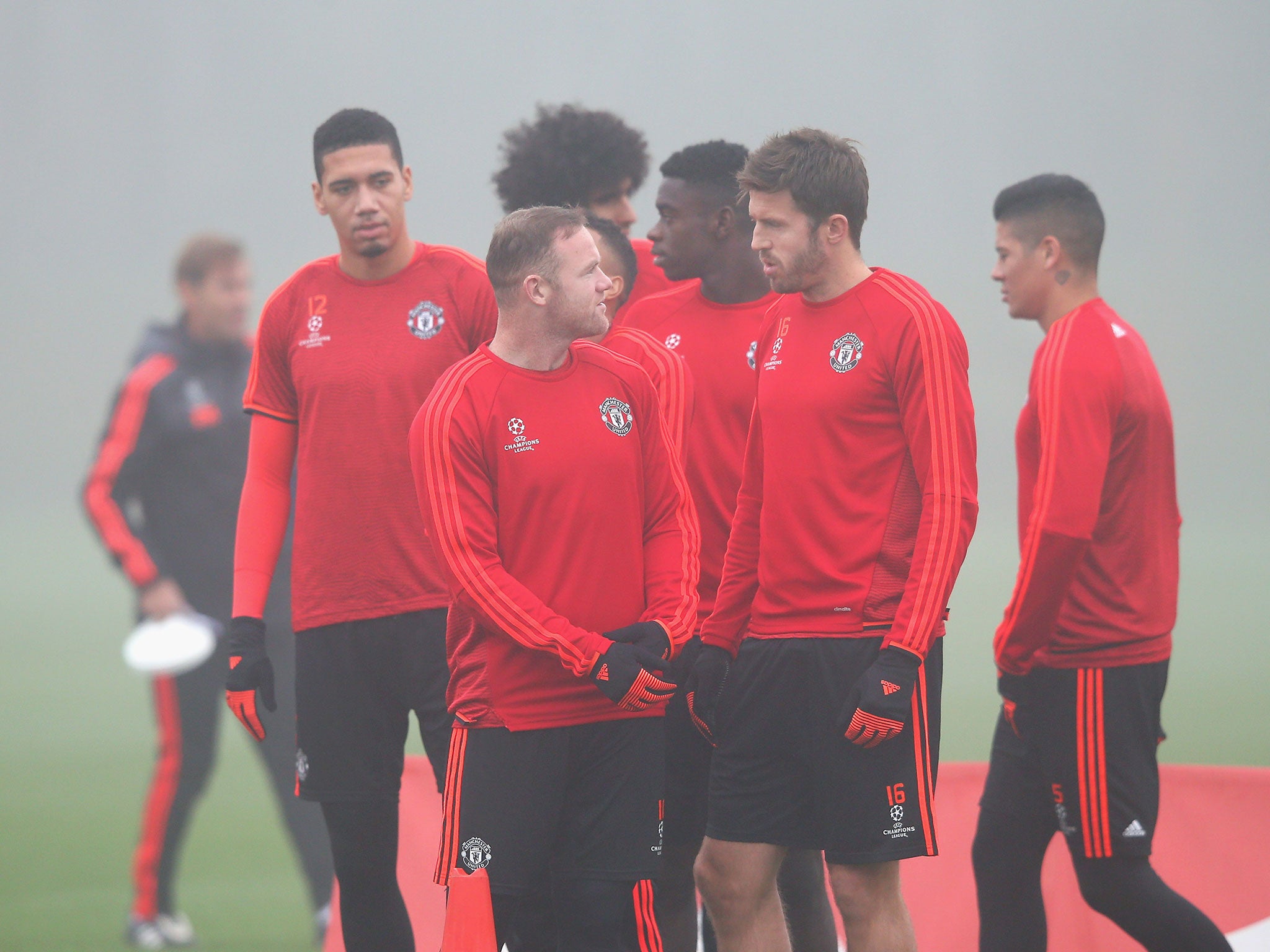 Wayne Rooney and Michael Carrick talk in training