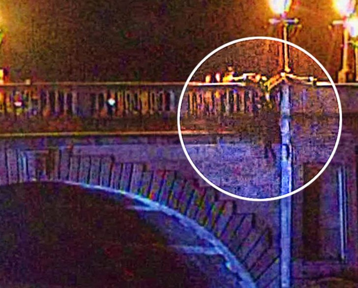 Police and firefighters came to the women's rescue when she was spotted sitting on the wrong side of the bridge ledge