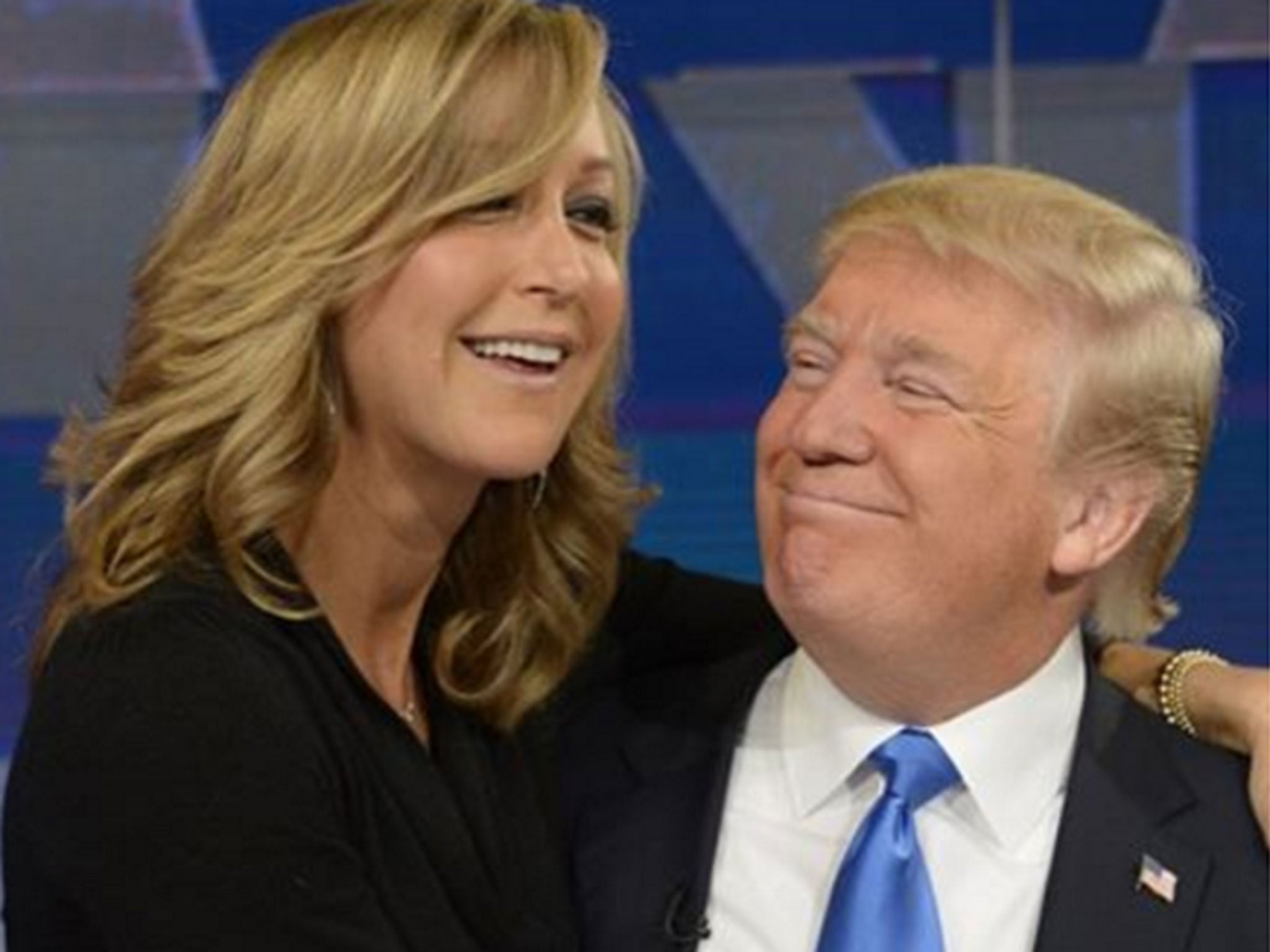 Lara Spencer sits on Donald Trump's lap