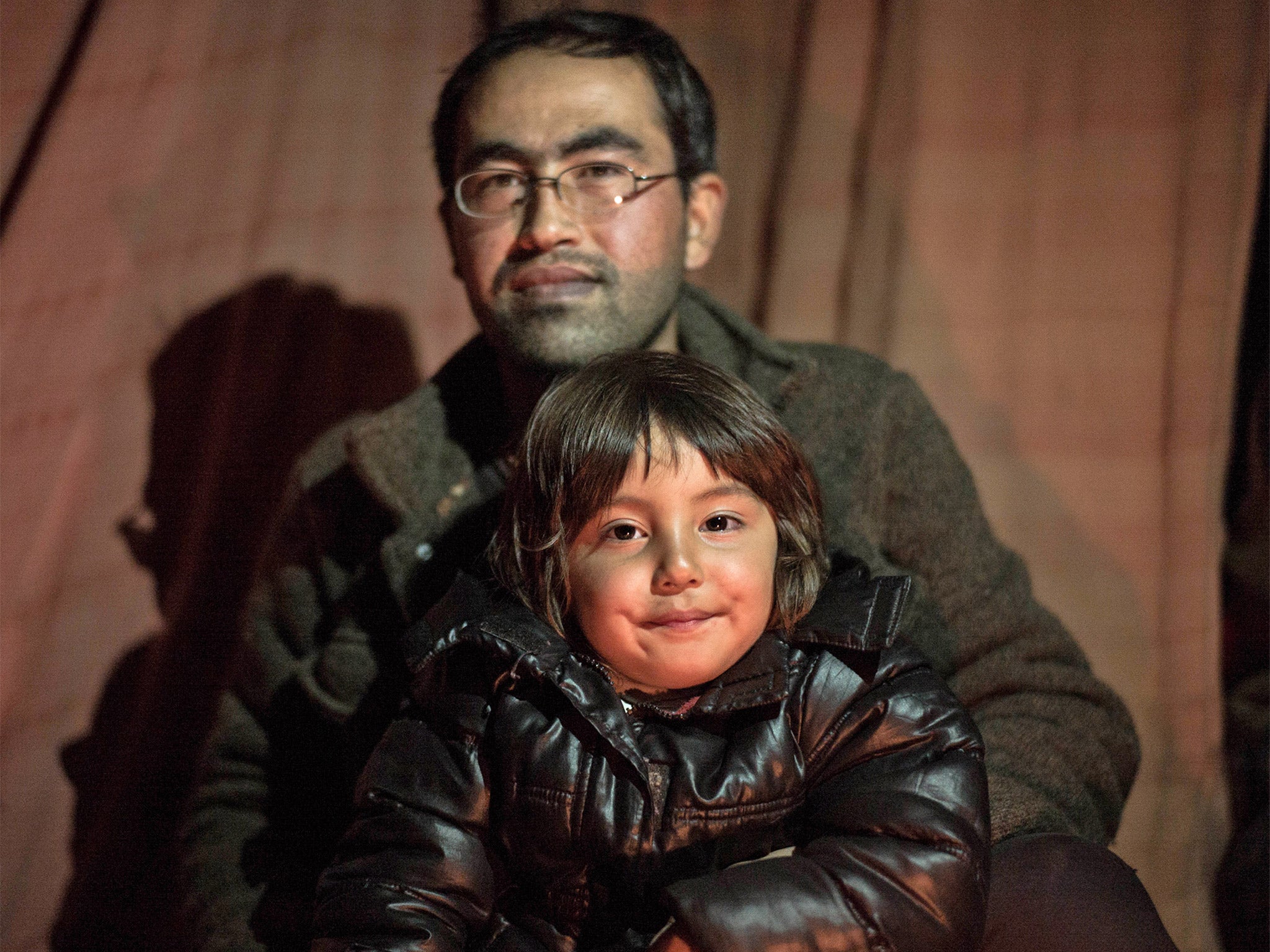 &#13;
Bahar Ahmadi, 4, who is still living with her father, Reza, in the refugee camp in Calais &#13;