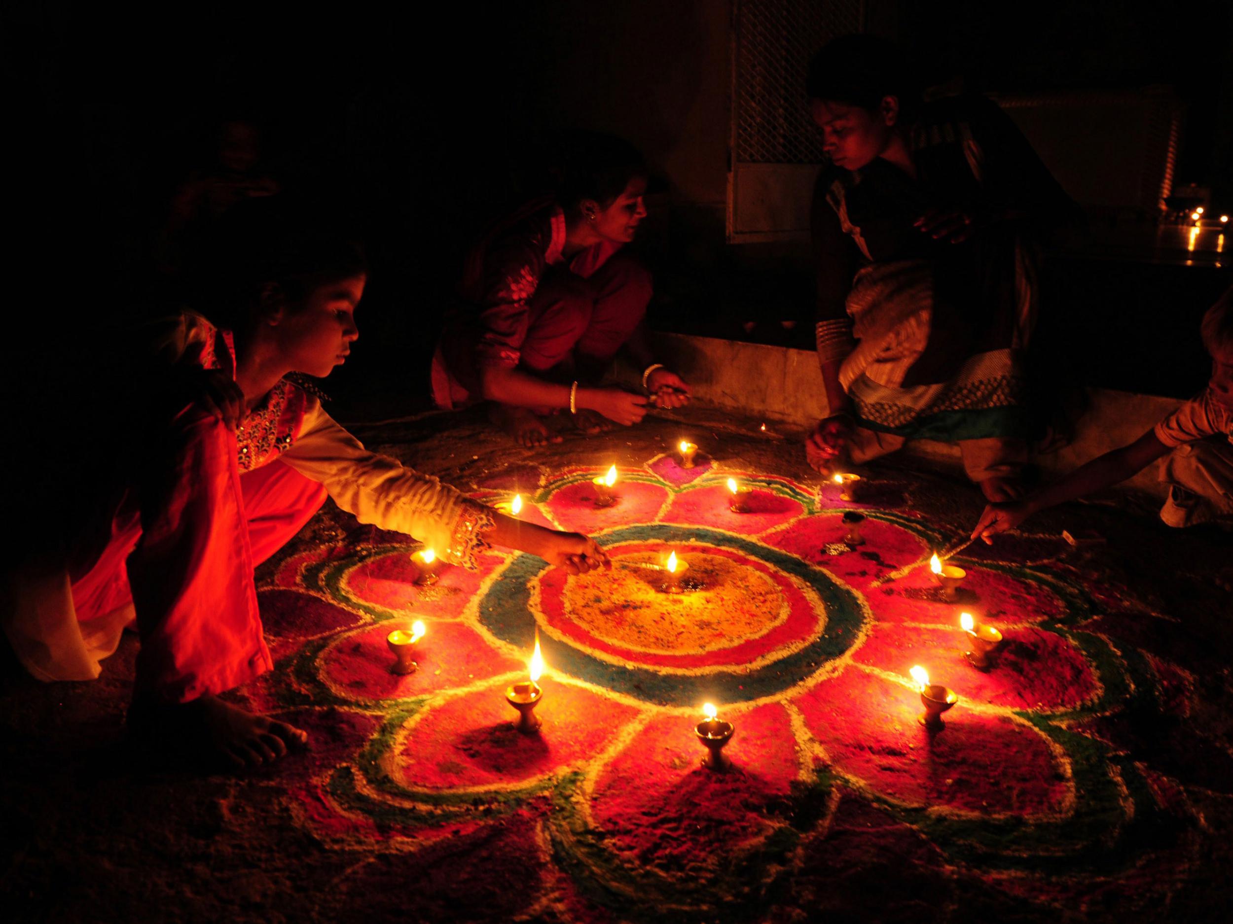 Pakistan's minority Hindu community decorate with earthen oil lamps as they celebrate Diwali in Lahore Getty