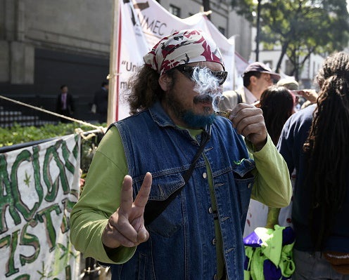 Campaigners celebrated the news by smoking outside the court house