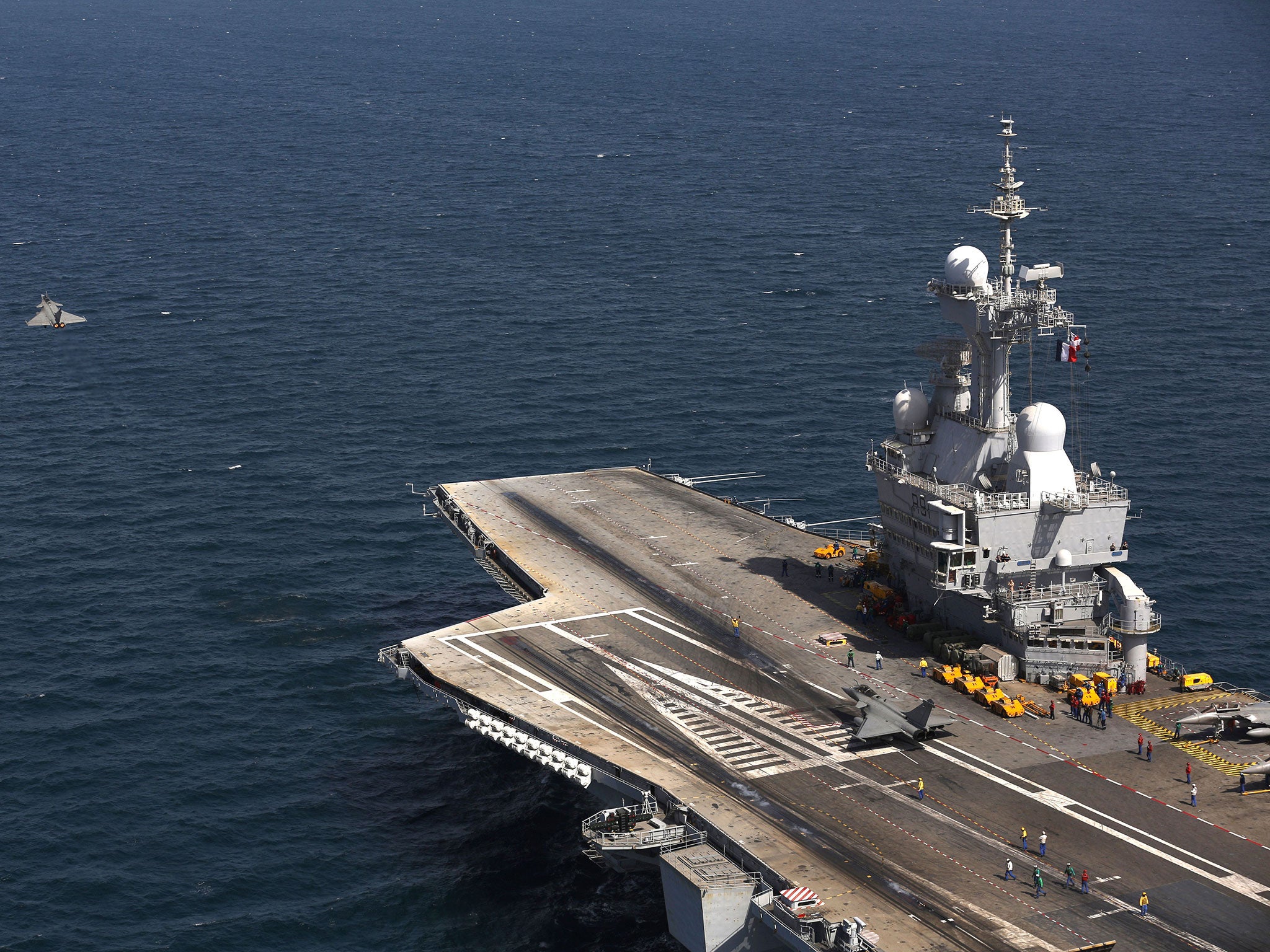 A French navy Rafale fighter jet takes off from the aircaft carrier Charles de Gaulle operating in the Gulf on February 26, 2015.