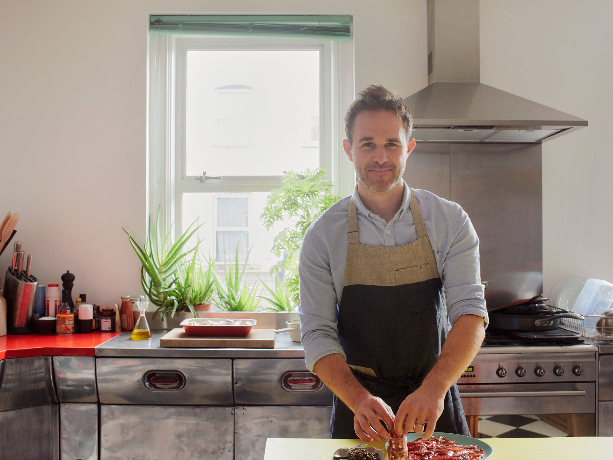 Ed prepares the anchovies and smoky peppers with capers