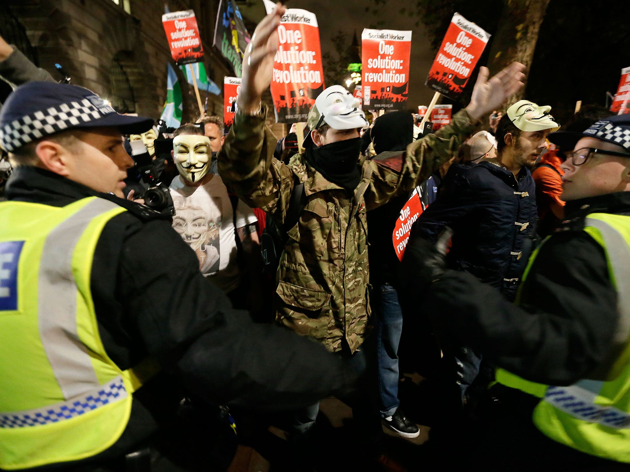 Police try to block the crowd