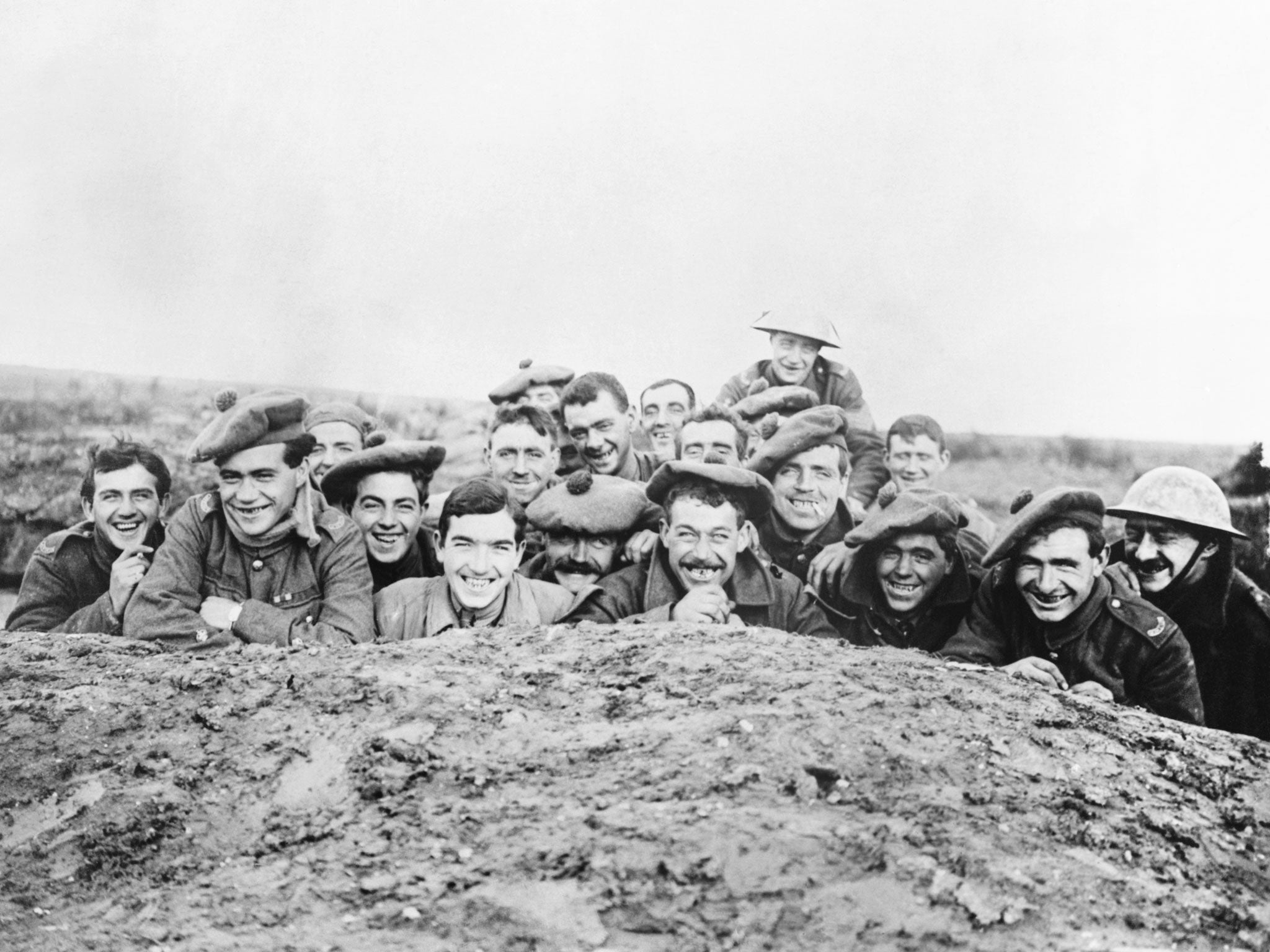 Gordon Highlanders smile for the camera from a reserve trench, 1916