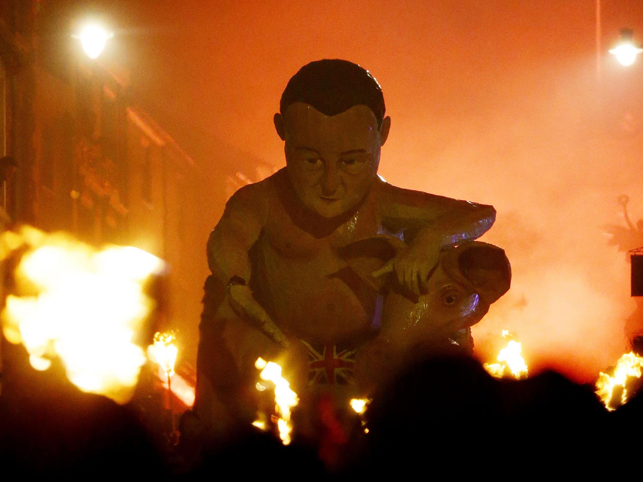 An effigy of Prime Minister David Cameron being paraded through the town of Lewes in East Sussex