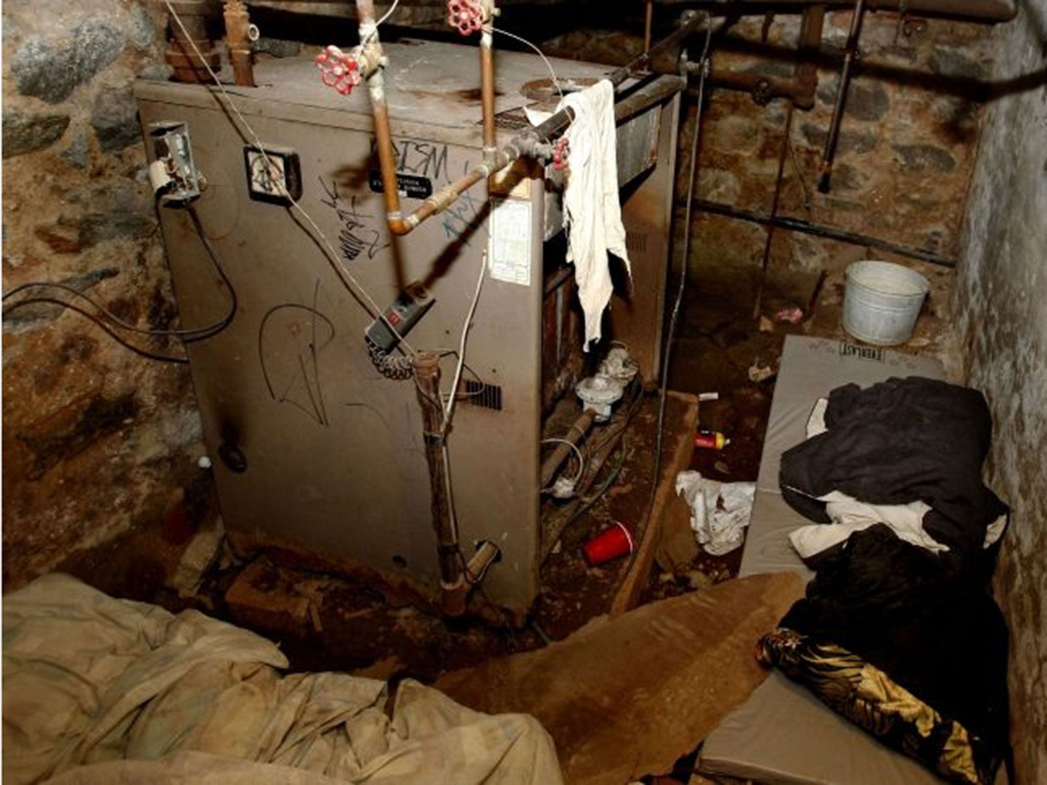 The basement room in Philadelphia where four weak and malnourished mentally disabled adults, one chained to the boiler, were found locked inside