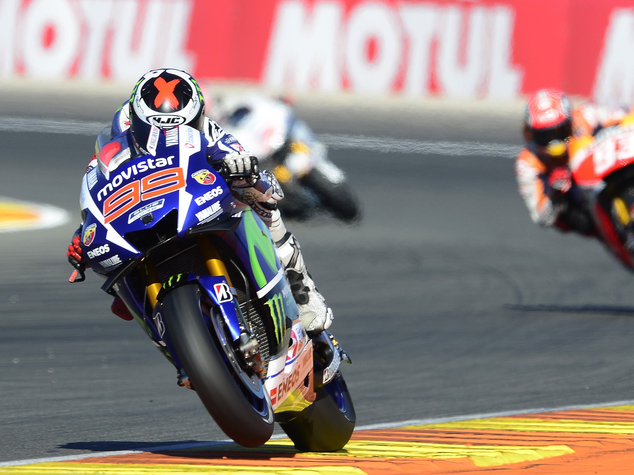 Movistar Yamaha MotoGP's Spanish rider Jorge Lorenzo rides ahead of the chasing pack