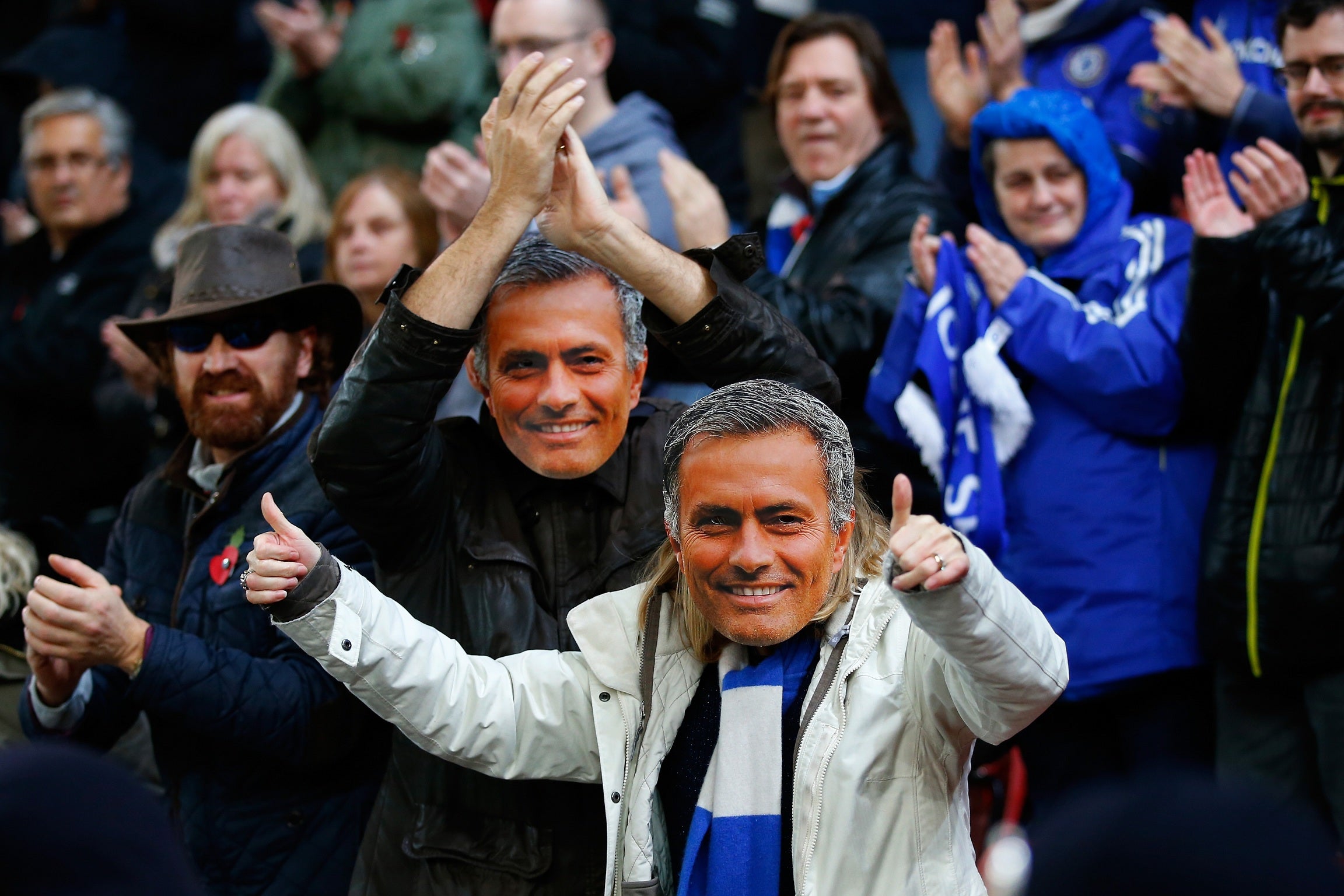 Chelsea fans cheekily wear masks of their banned manager Jose Mourinho