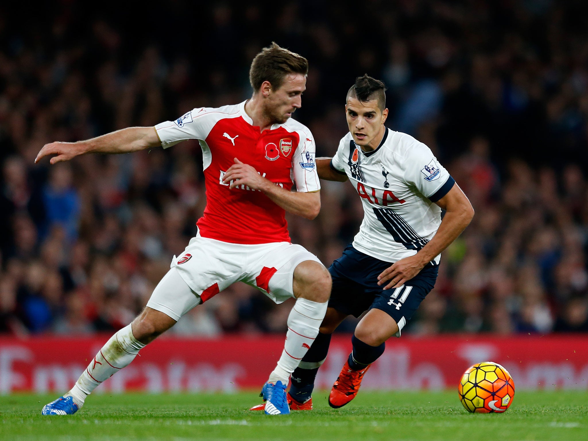 Nacho Monreal (left) has signed a new Arsenal contract