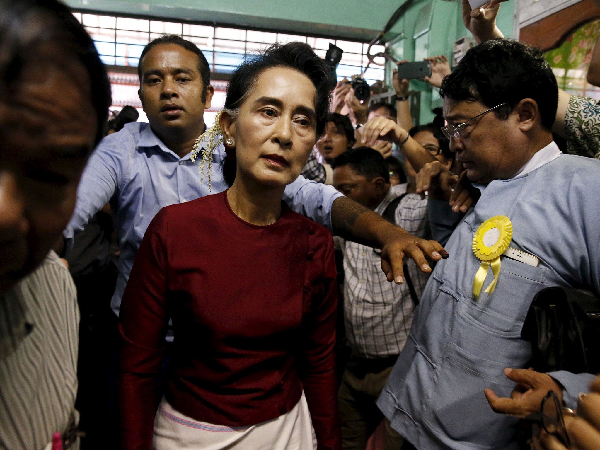 Party leader Aung San Suu Kyi arrives to cast her vote