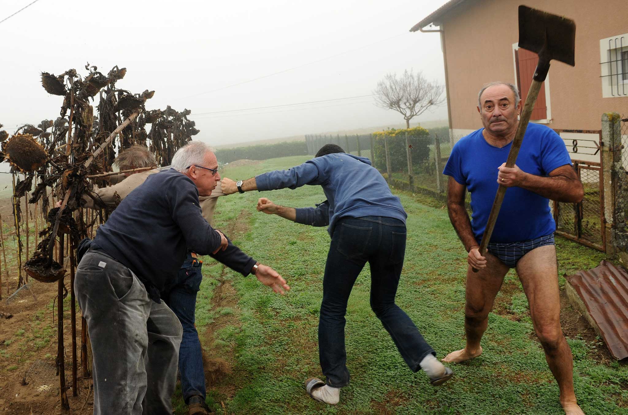 One man was seen, apparently dressed in just his pants and a T-shirt, waving a shovel