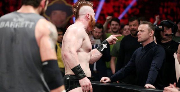 Irishman Sheamus confronts Rooney and Barrett makes his way over