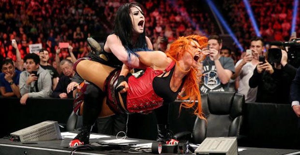 Paige attacks Becky Lynch after the bell