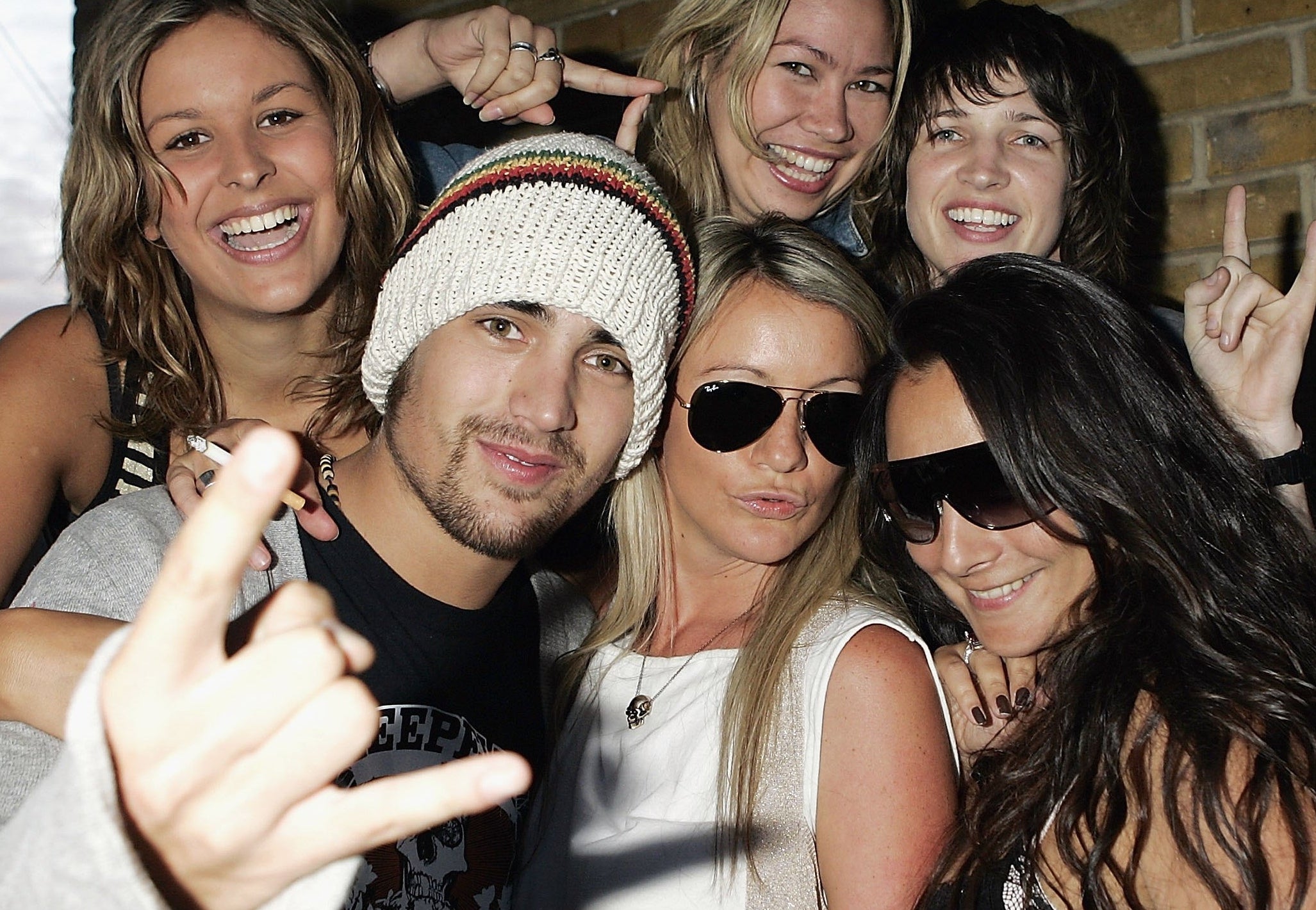LeAnna (Ladybird), Charlie Simpson of Fightstar, Rachel (DJ Rohypnol), Tara( Tarzi), Melanie (Speaking) Lucie (The Specialist) of Girl Group Tarzi pose backstage at the Kerrang!