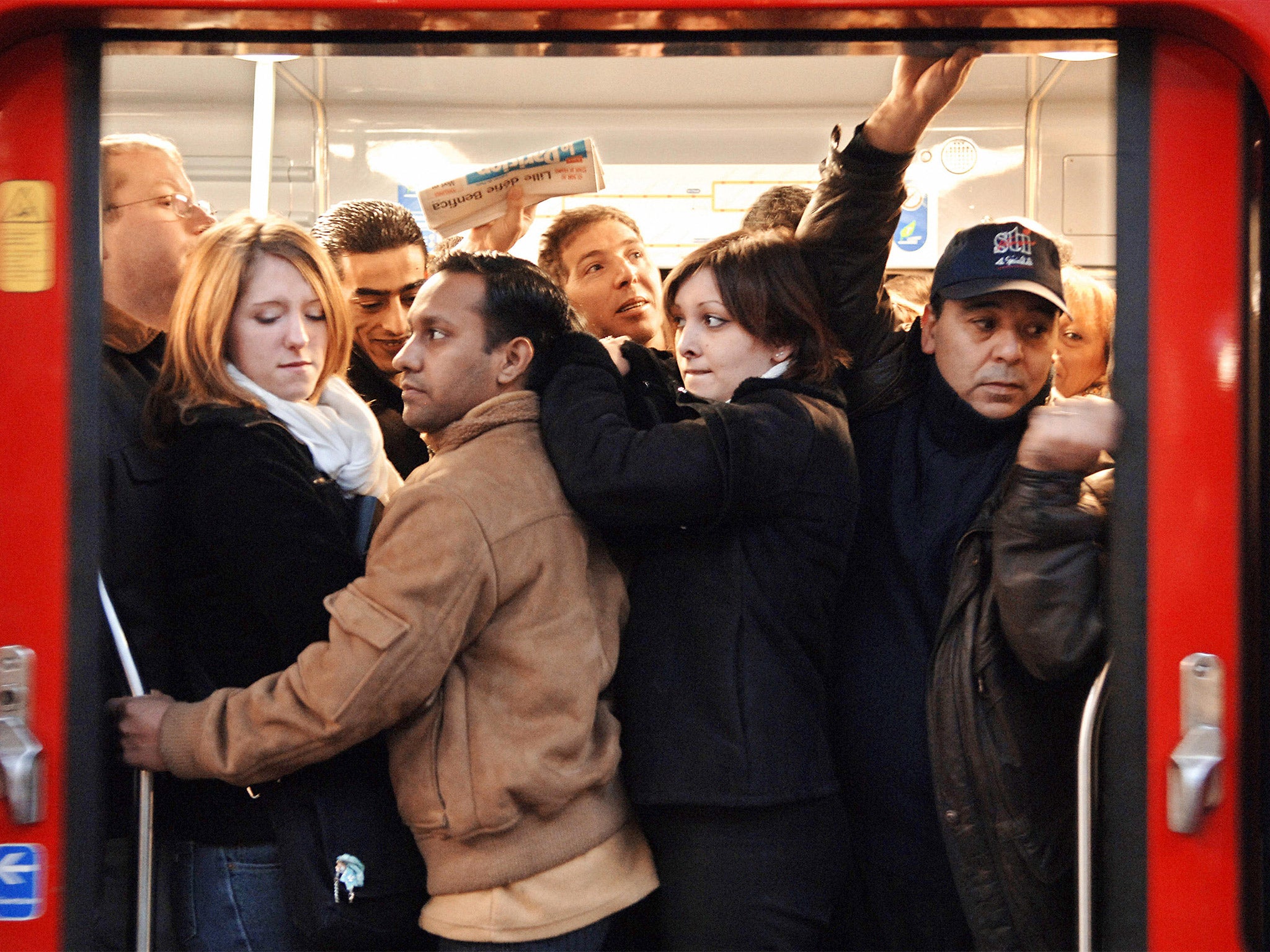 Commuters board an over-crowded Metro train in Paris. File photo (Getty)