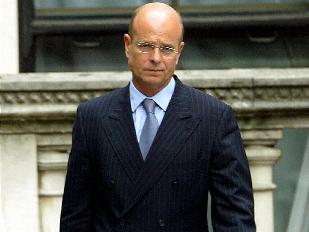 Retired spy boss Sir John Scarlett, pictured leaving the Hutton inquiry in 2003