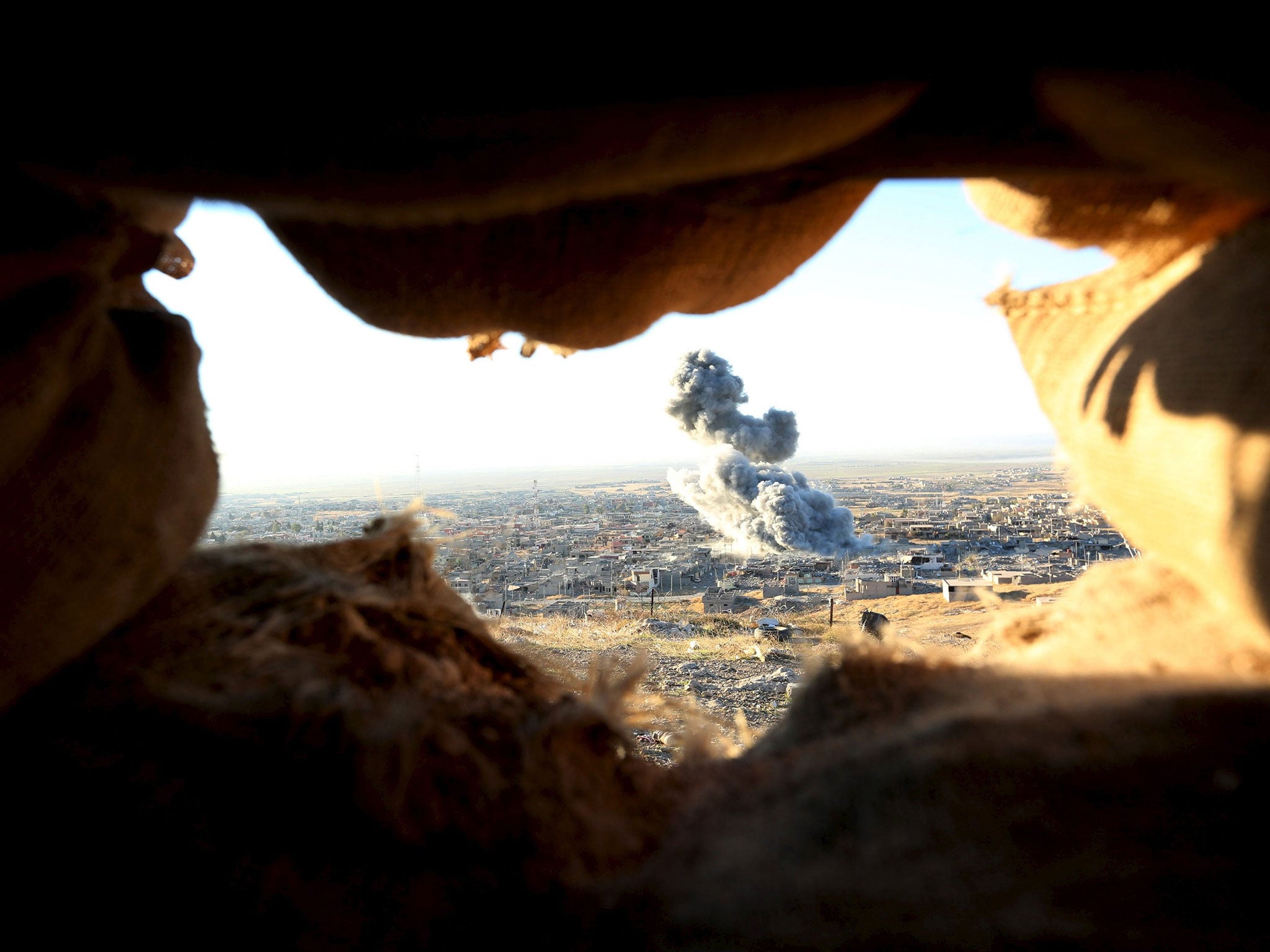 Smoke rises from the site of U.S.-led air strikes in the town of Sinjar, November 12, 2015. Kurdish forces launched an offensive on Thursday to retake the northern Iraqi town of Sinjar from Isis militants