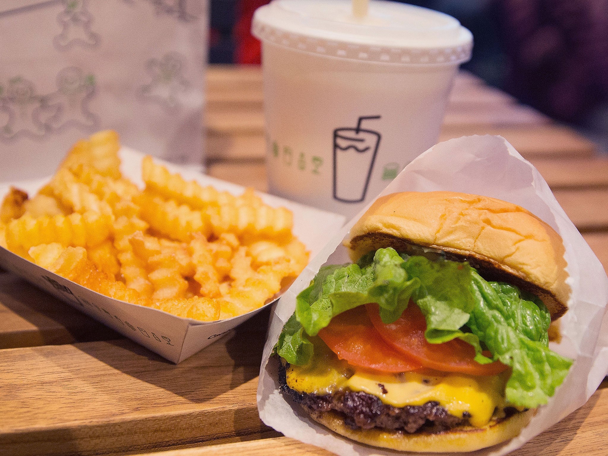 A cheeseburger and french fries are served up at a Shake Shack restaurant in Chicago, Illinois.