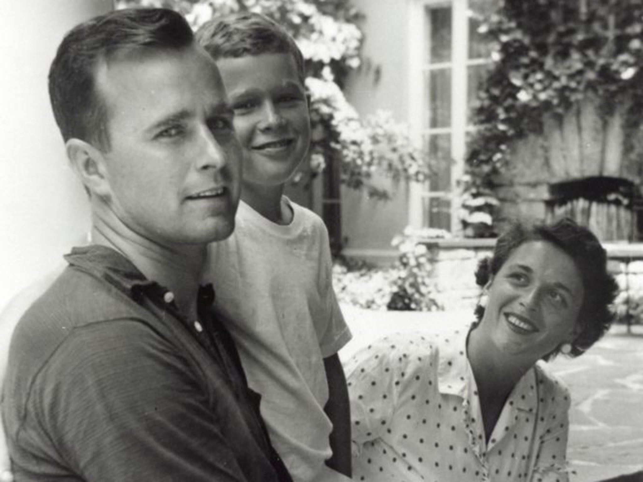 George HW Bush with son George and wife Barbara in 1955