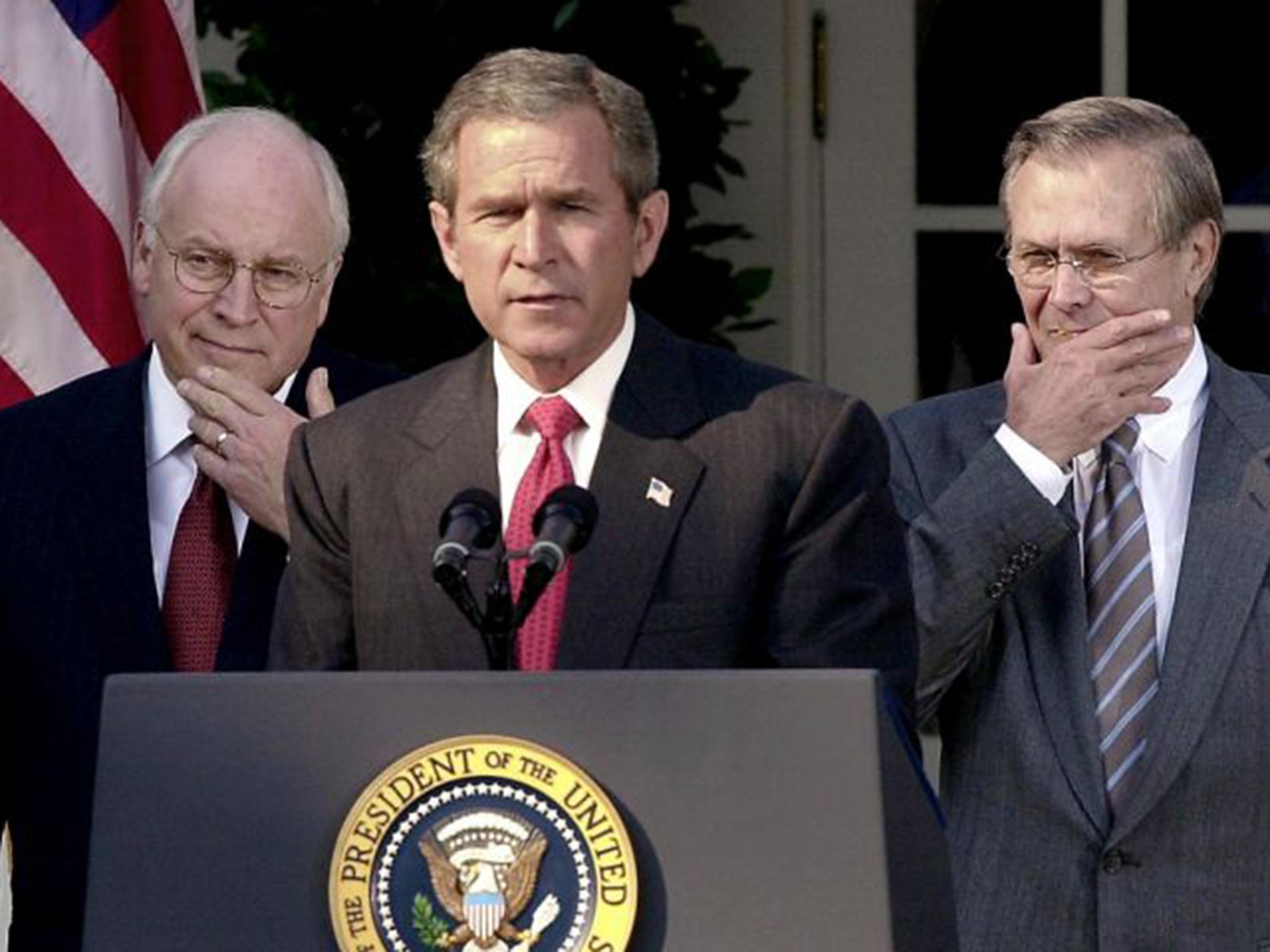 The president’s men: George W Bush flanked by Dick Cheney, left, and Donald Rumsfeld