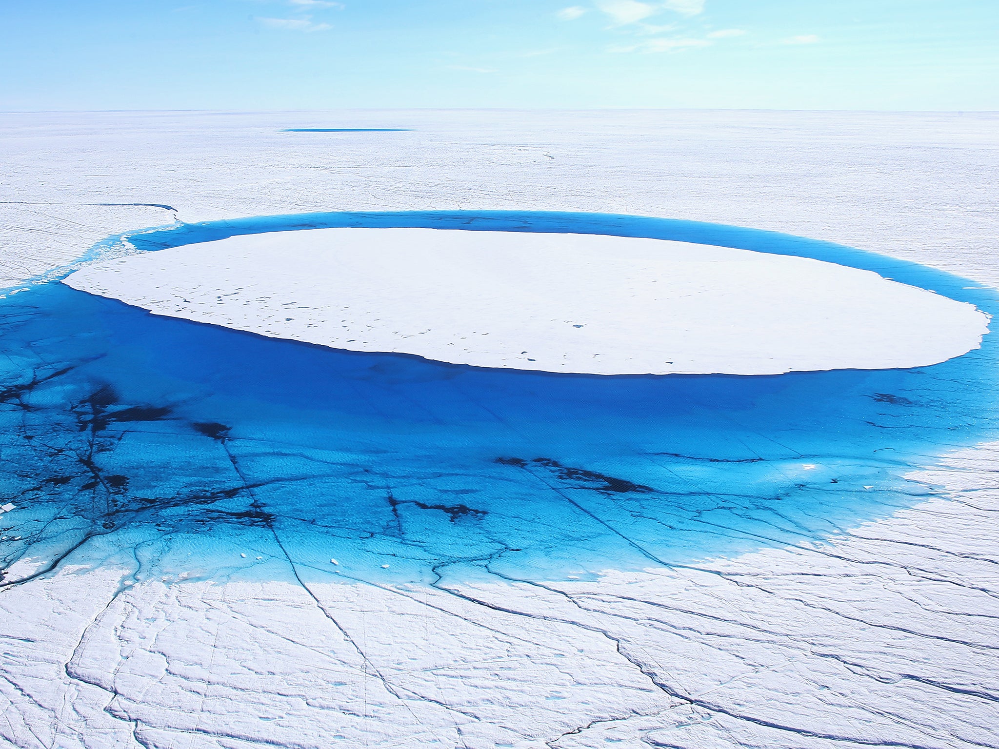 Water is seen on part of the glacial ice sheet that covers most of Greenland. Up to 95 per cent of the floating, sea-based part of the glacier has been lost since 2002