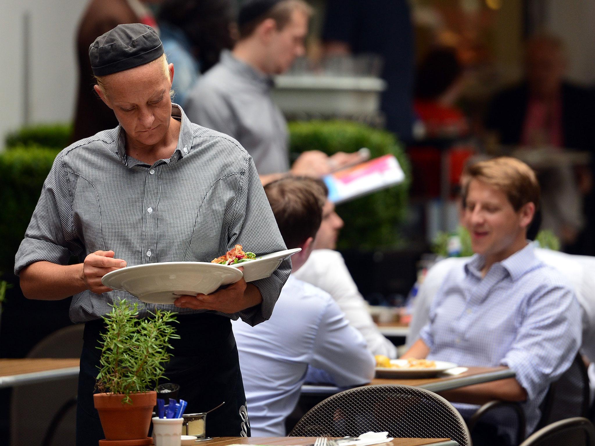 Waiting staff are among those who live with insecure employment in Britain's flexible economy