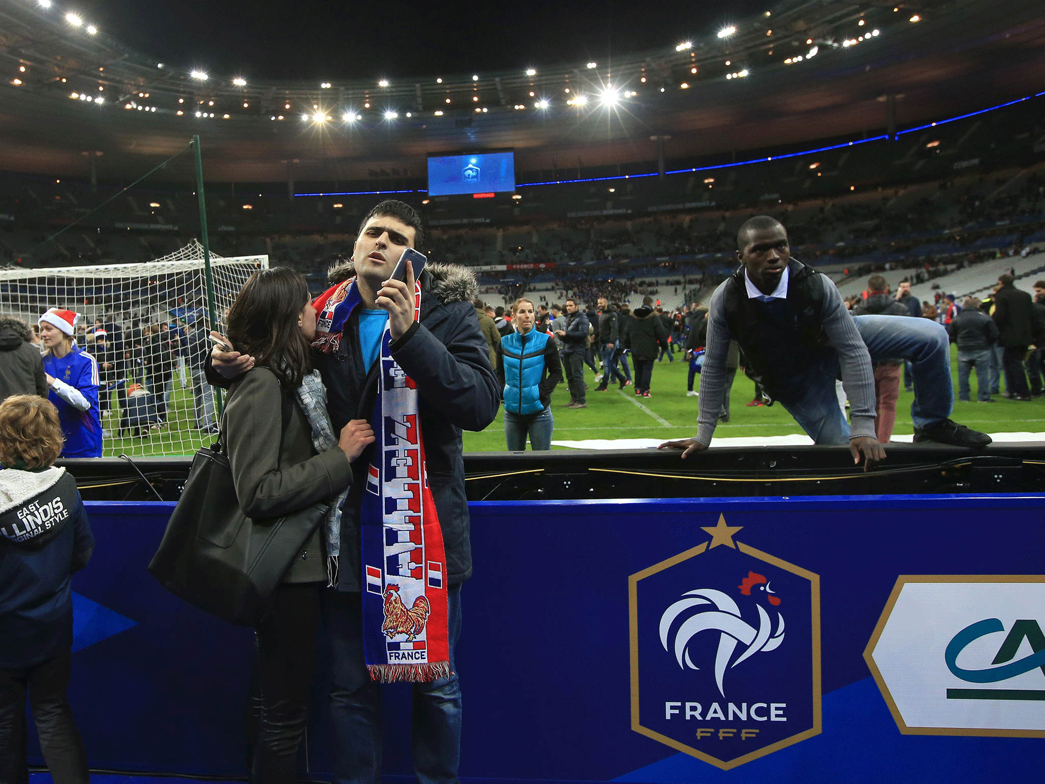 Fans pitchside at the Stade de France after news of explosion's in Paris broke.