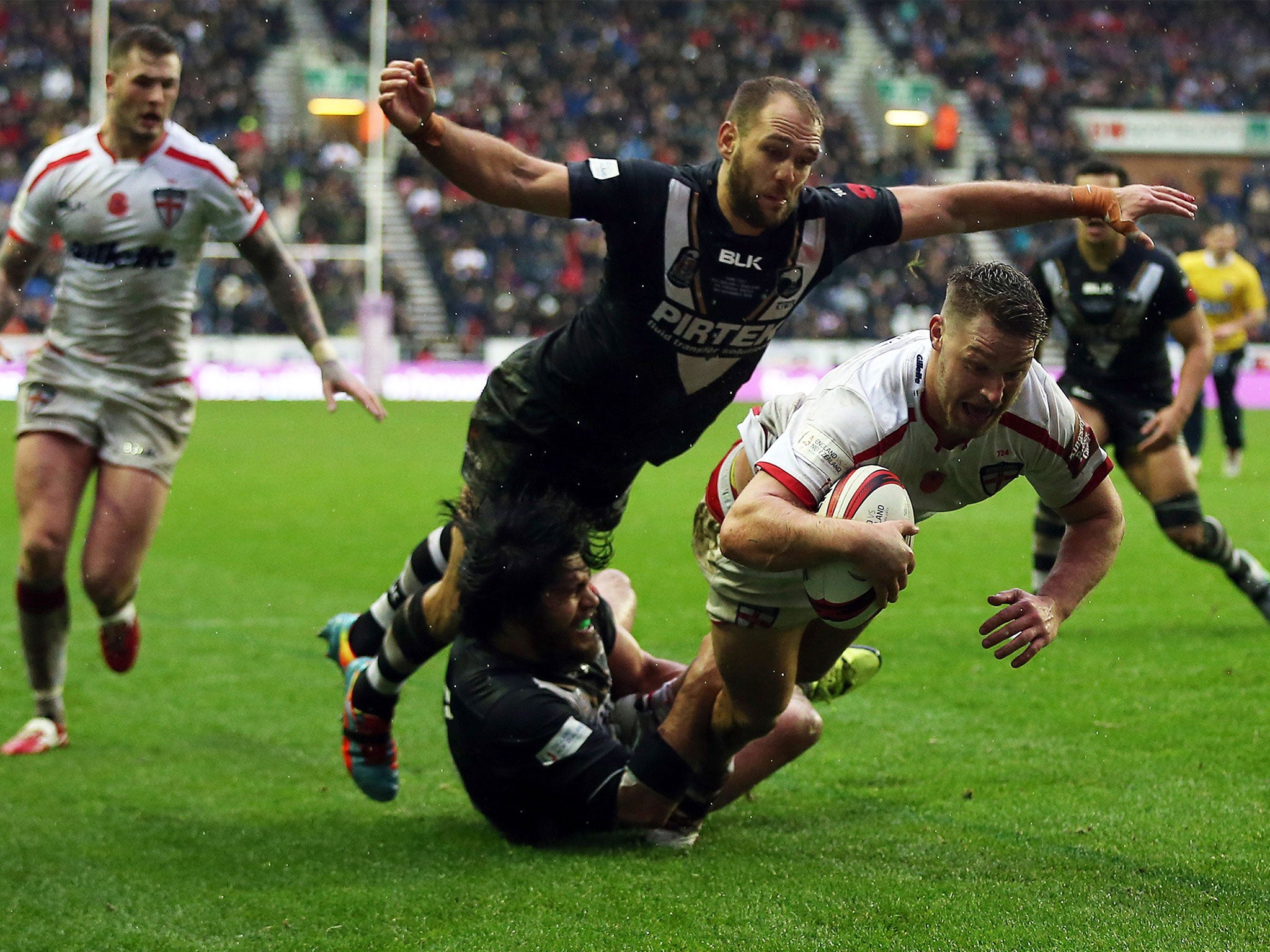 England's Elliott Whitehead scores a try against New Zealand