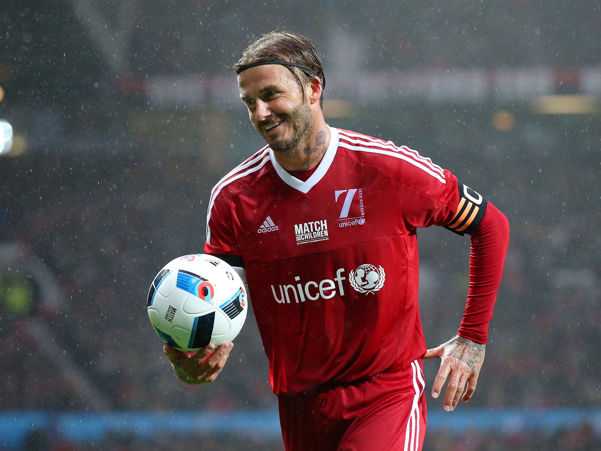 David Beckham smiles during a charity match at Old Trafford