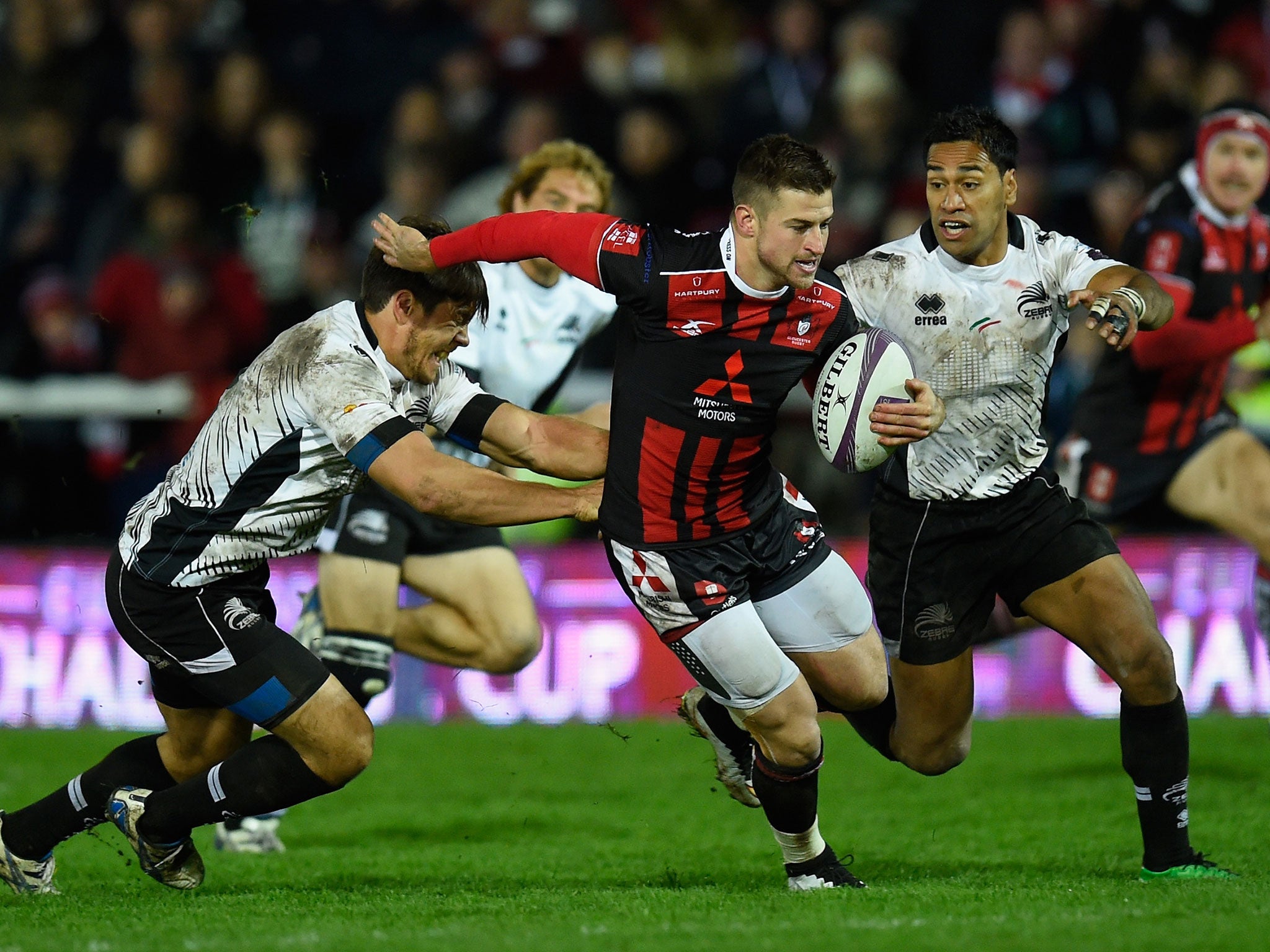 Gloucester centre Henry Trinder tries to evade the Zebre defence