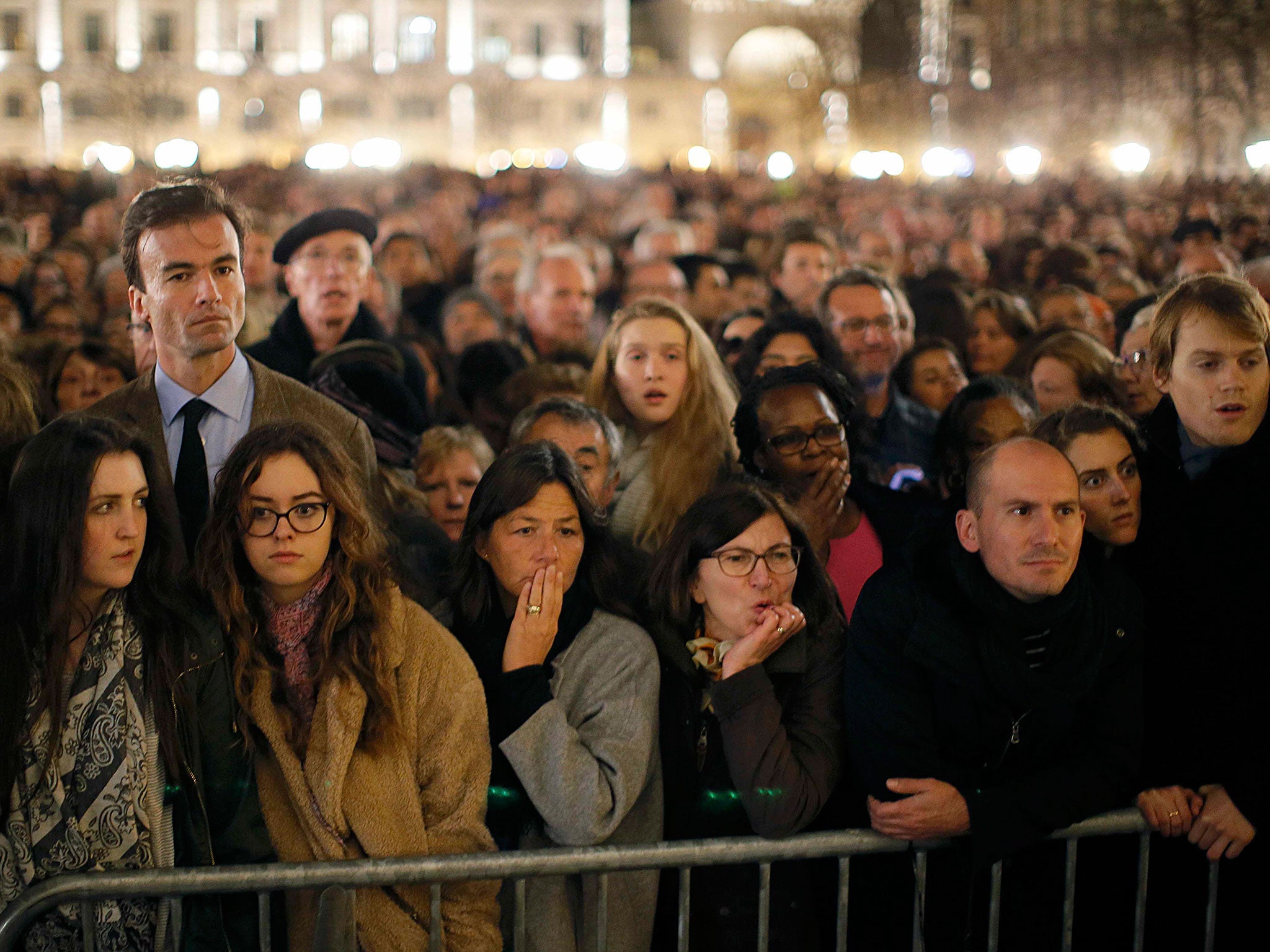 People remember the dead outside Notre Dame