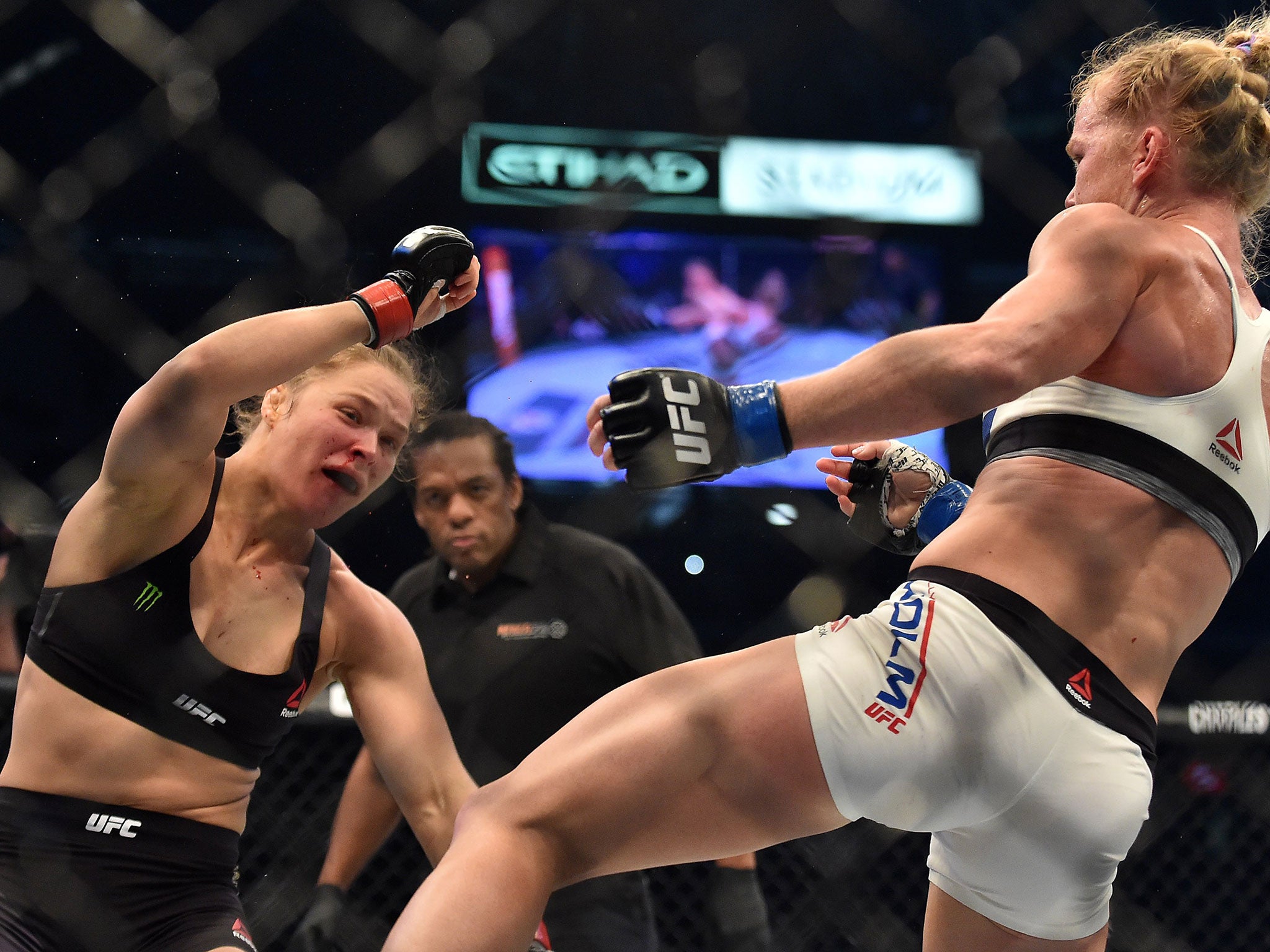 Ronda Rousey is rocked as Holly Holm delivers a knockout kick to win the UFC bantamweight title