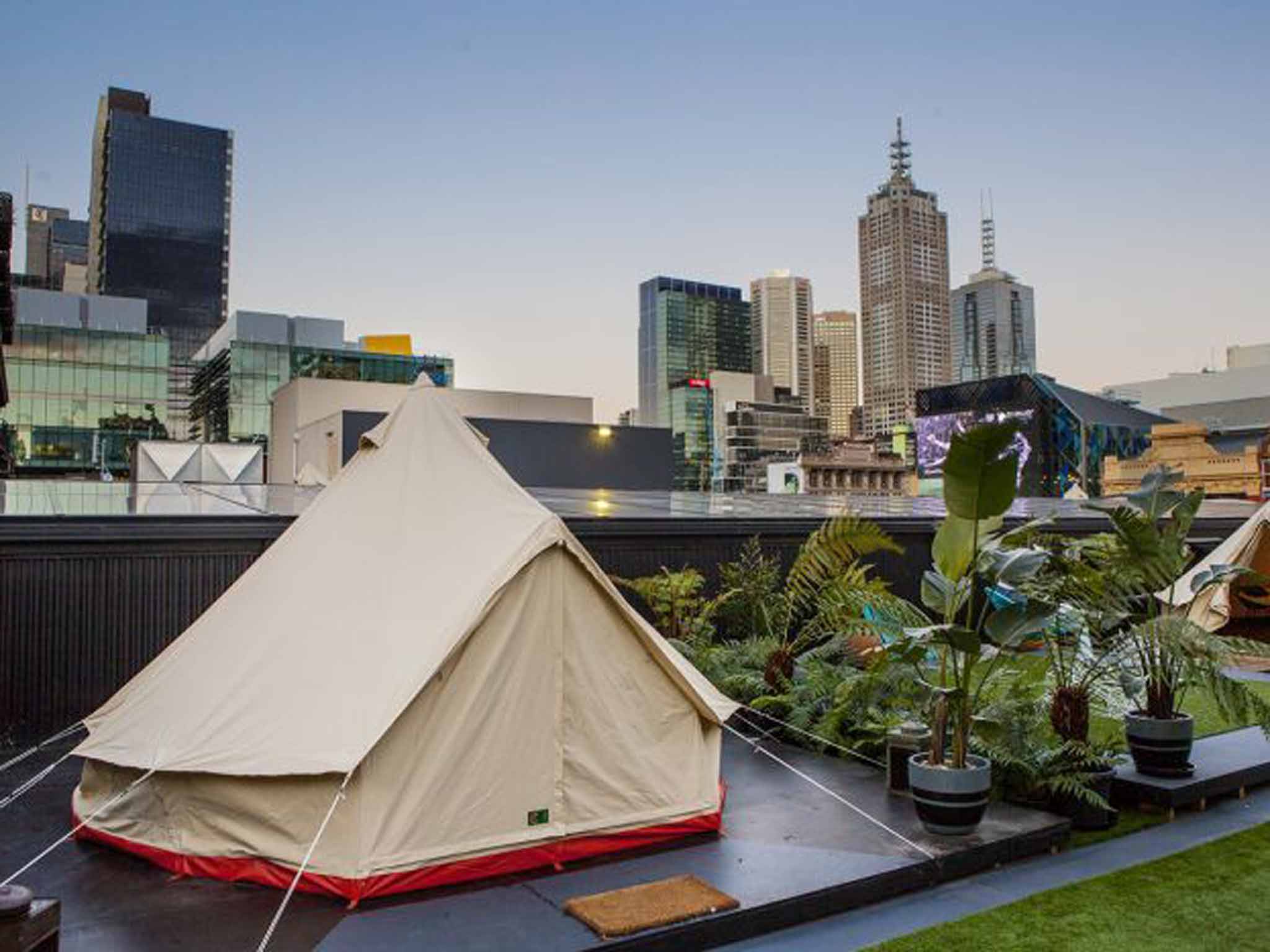 Tents are separated by plants