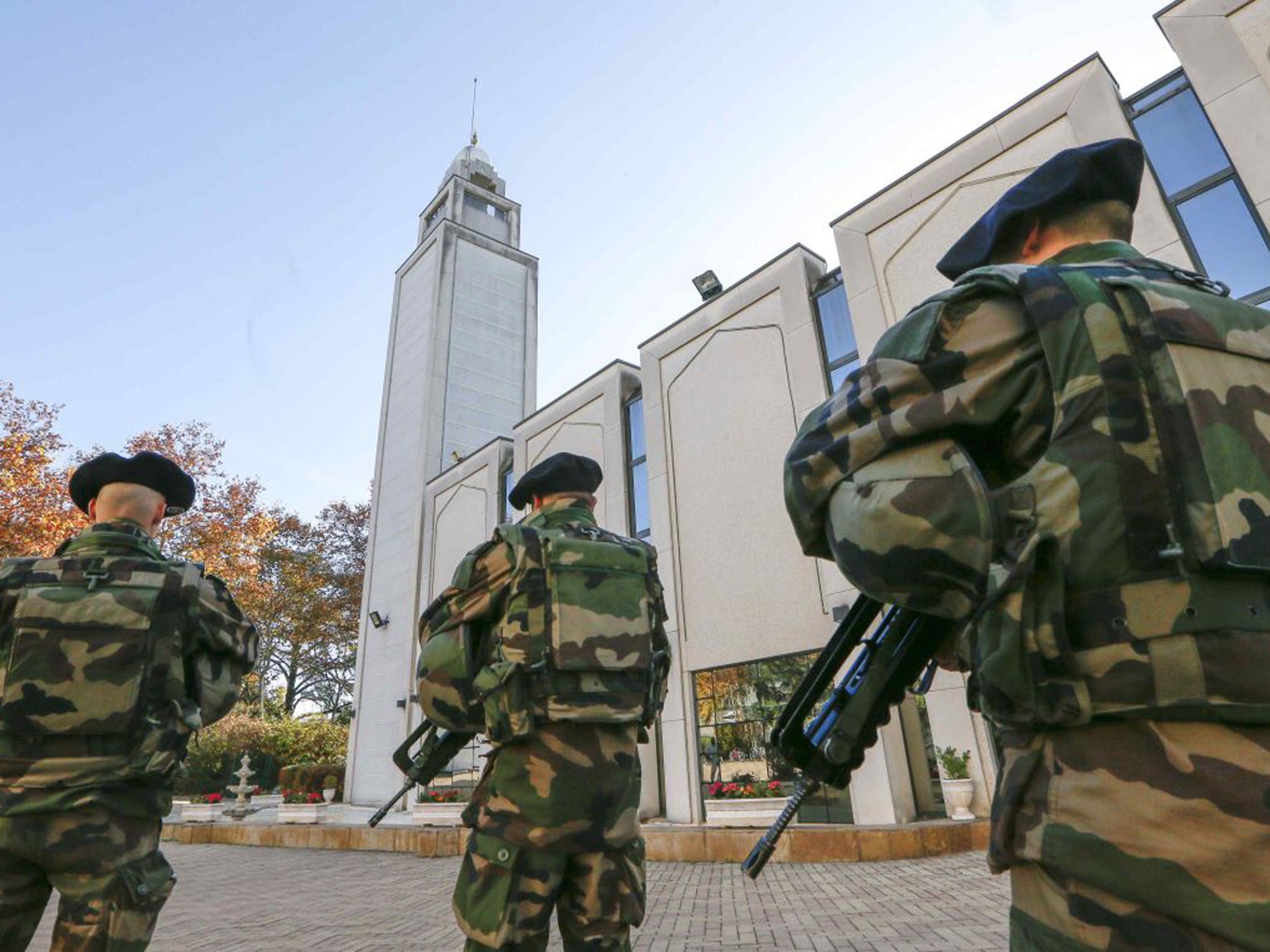 French paratroopers patrol outside the Great Mosque in Lyon