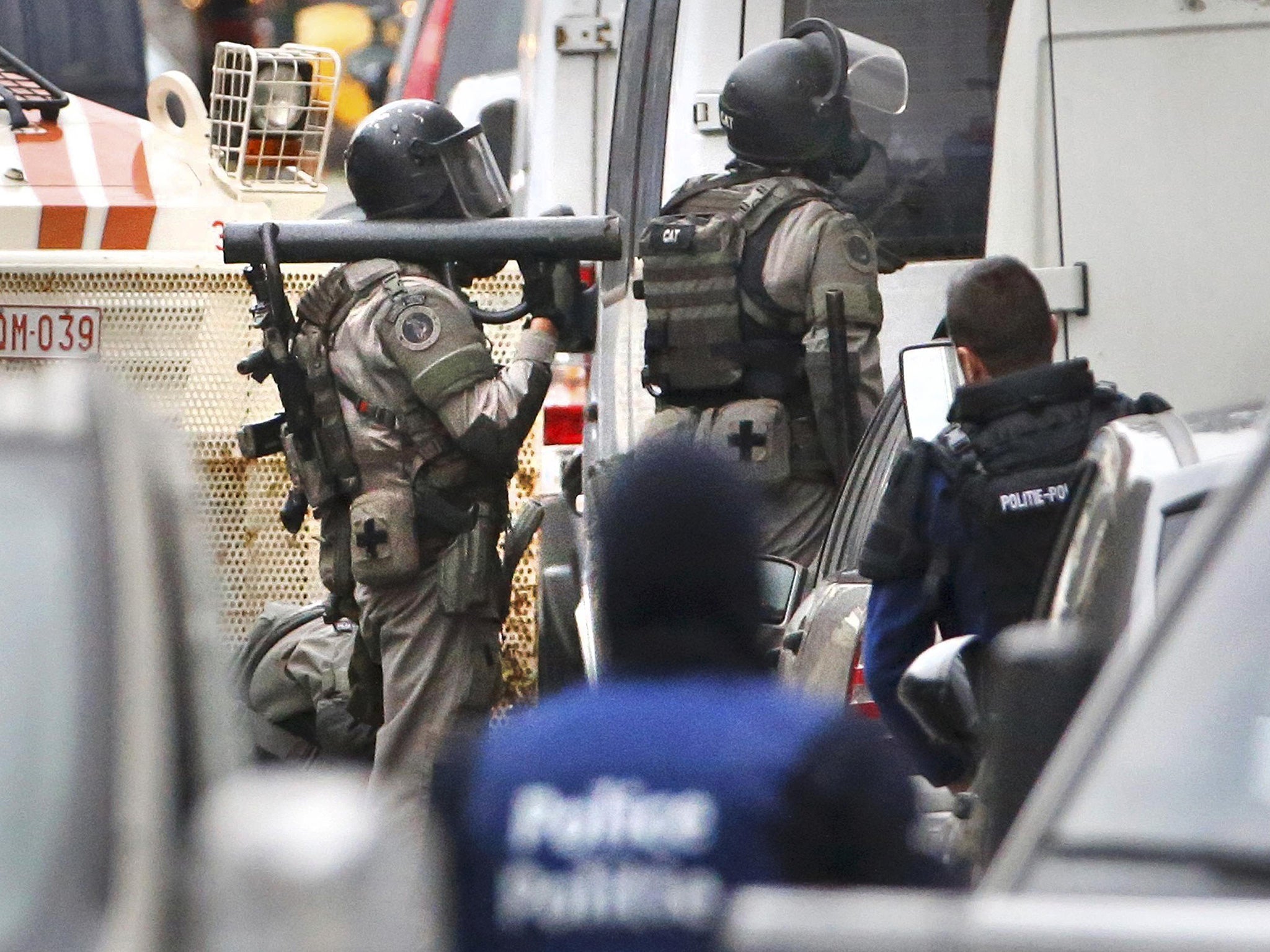 Belgian police stage a raid, in search of suspected muslim fundamentalists linked to the deadly attacks in Paris, in the Brussels suburb of Molenbeek