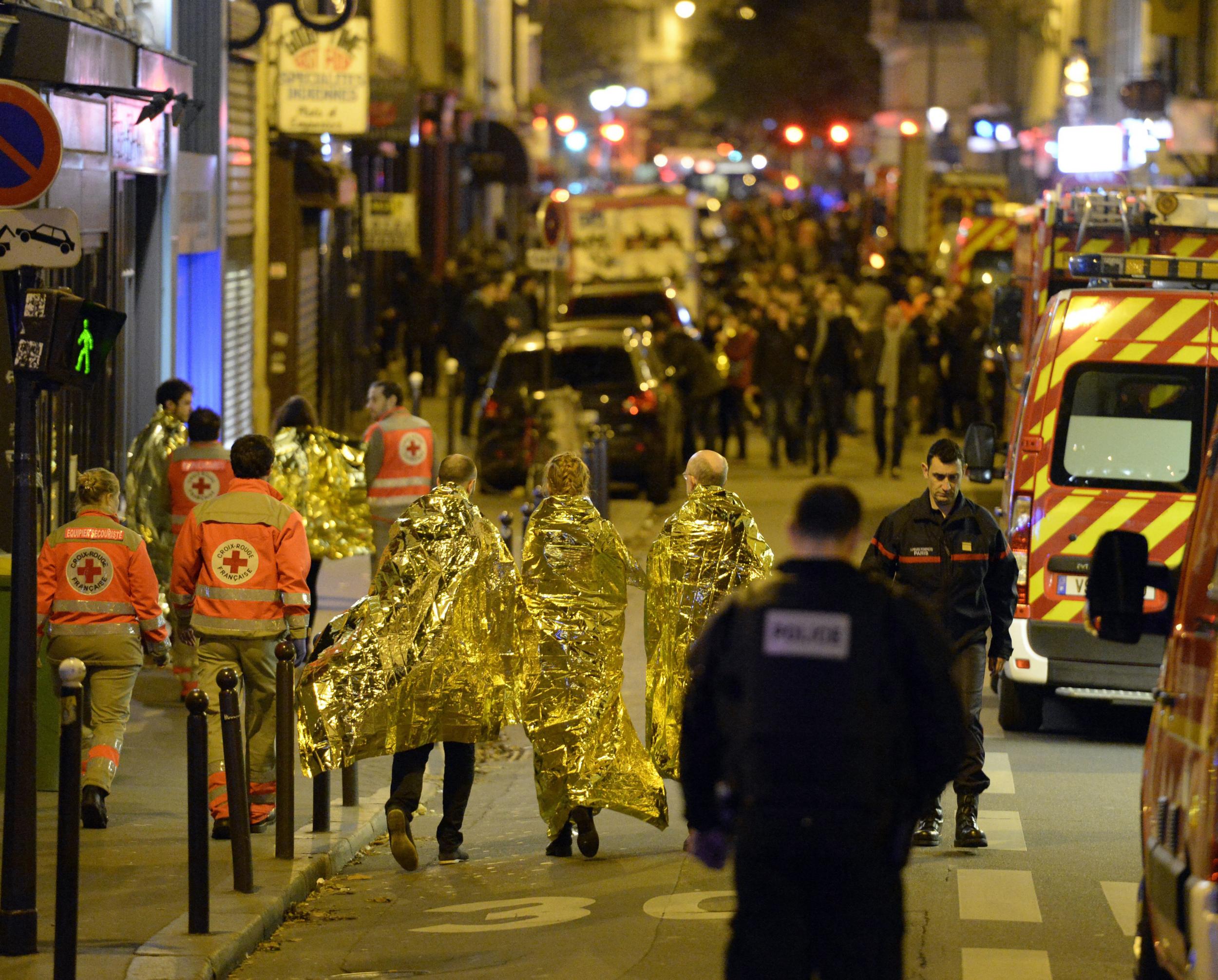 Survivors at the Bataclan theatre on Friday night. Ill feeling towards Muslims and refugees has spiked in the past week