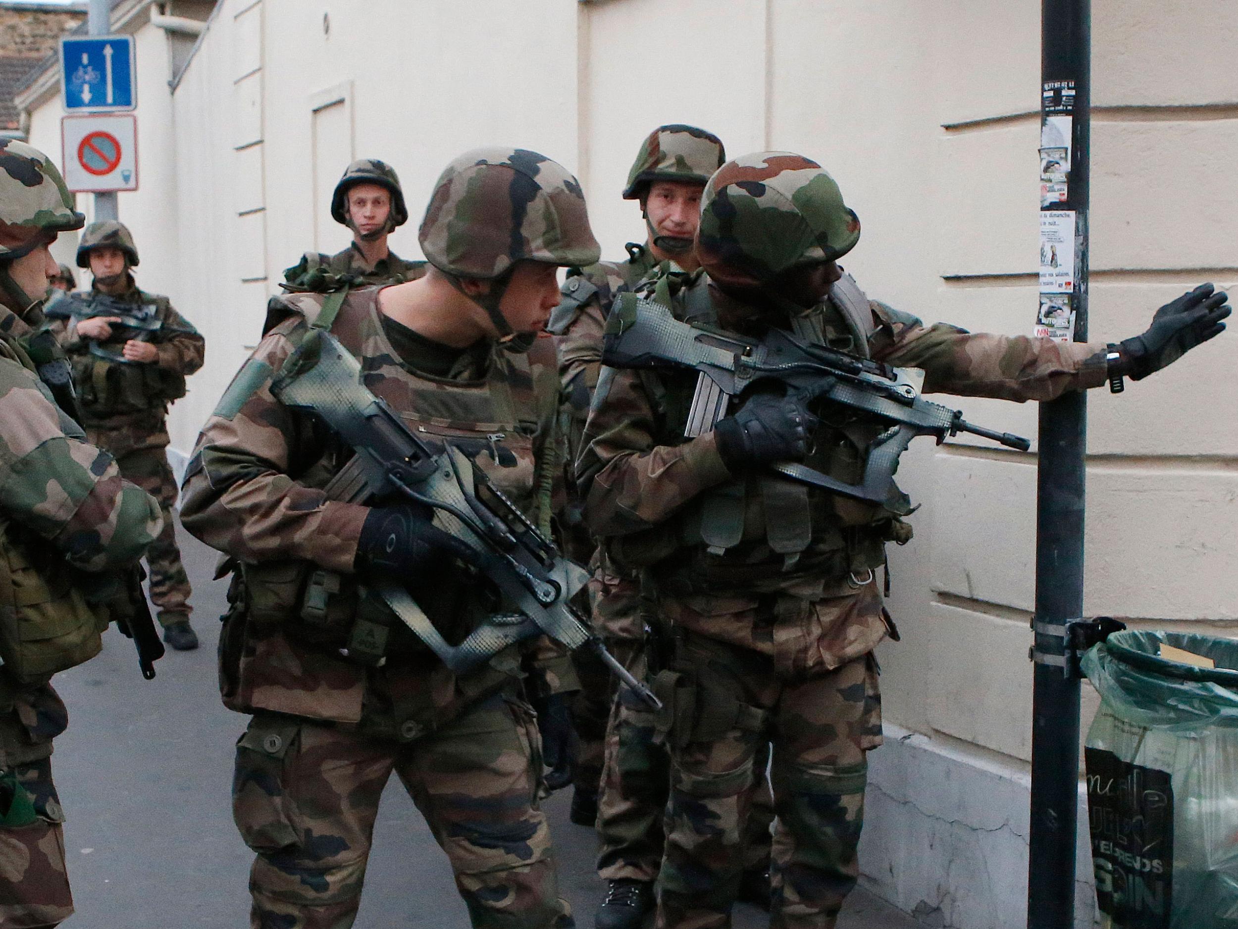 Police say two suspects in last week's Paris attacks, a man and a woman, have been killed